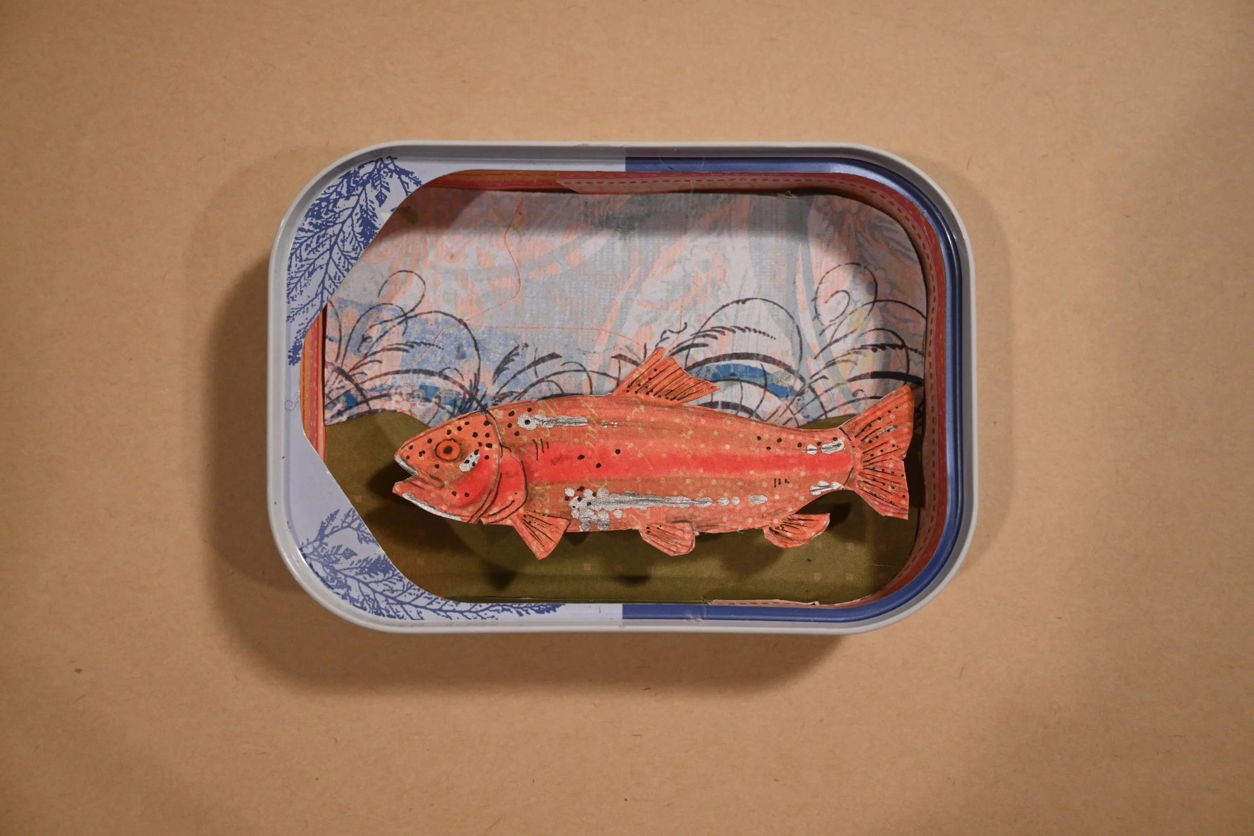 "Canned Trout In A Can, Of Course" (metal can, paper, foil, ink)