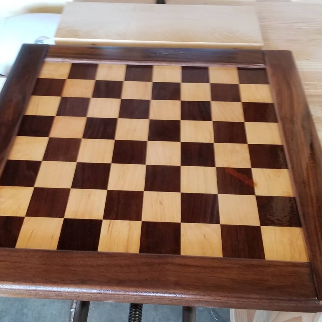 Unfortunately I didn't make this chess board, but I did restore it. 
The first pic is the completed board. You can see there was a lot of glue from the owner's attempt to fix it. There was also a piece of the original walnut that came off. Unfortunat