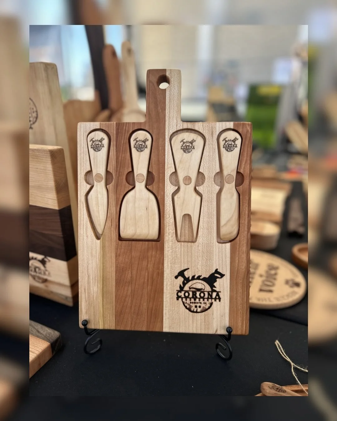 New! We made this beautiful maple and cherry board that comes with four cheese knives. The knives and board have magnets in them to make storage easy and perfect for a picnic! You can message us to order your own board or stop by one of our events. I