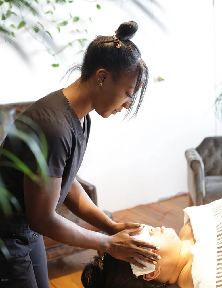 Simone giving a professional massage therapy treatment to a valuable client.