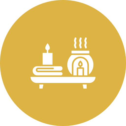 Simplified icon of a candle and a warming lamp on a table.