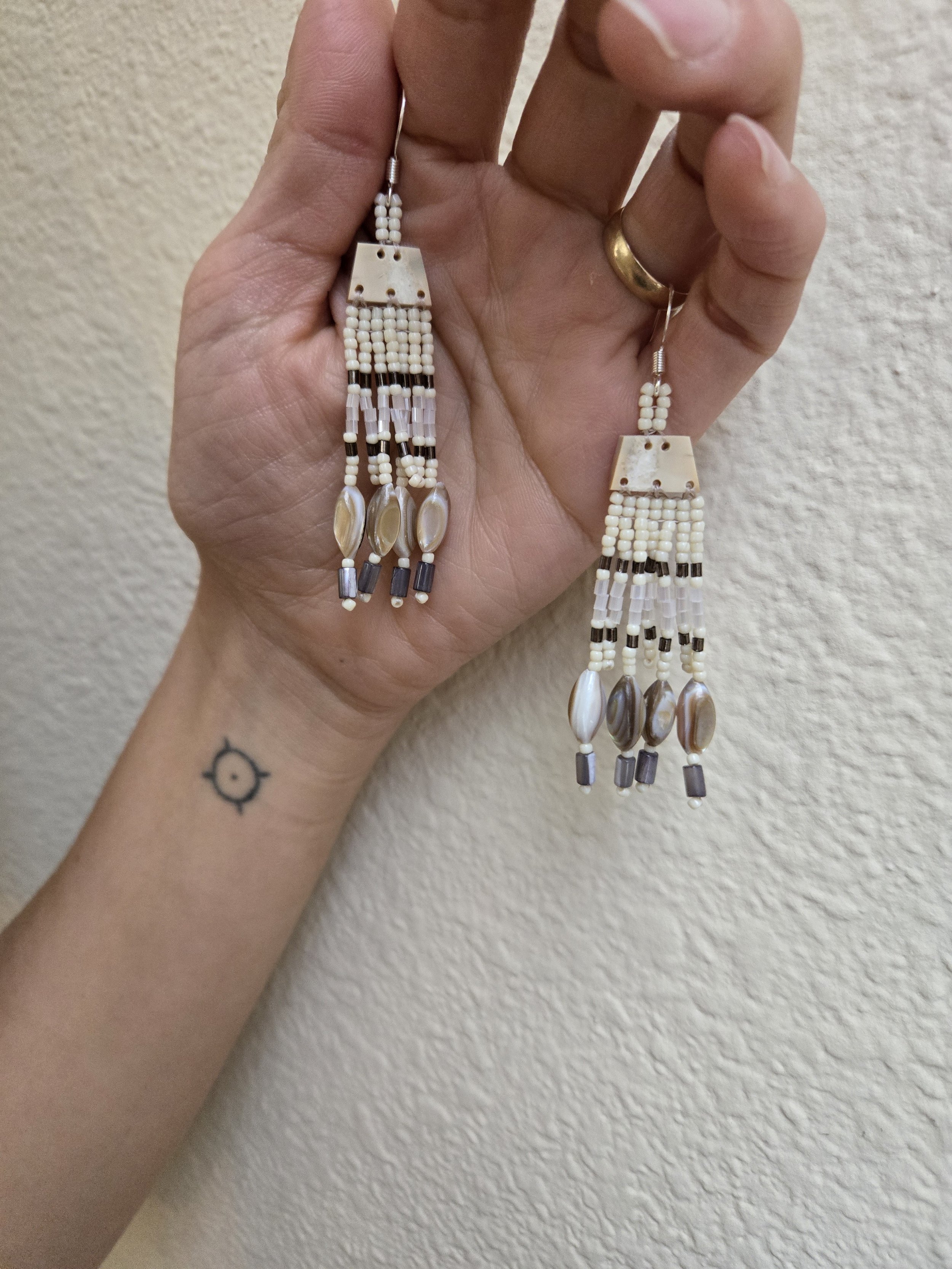 Walrus ivory jewelry Yup’ik Alaska Native artist