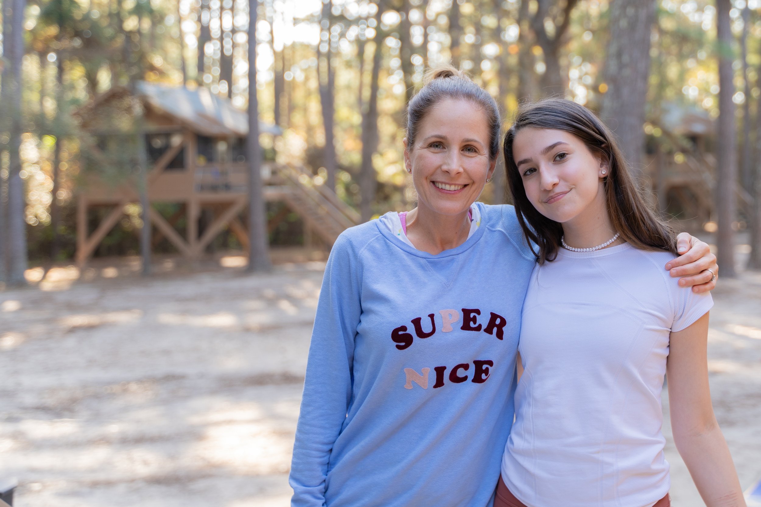mother daughter photo standing side by side with arms wrapped around outdoor at camp allen by photographer Lenee Love