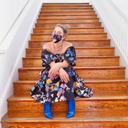Amanda in a colorful look on a staircase