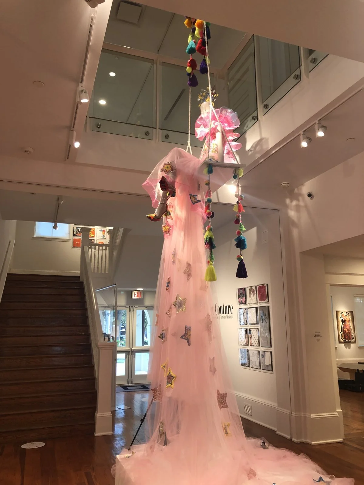 Amanda Perna's suspended pink tulle gown installation at the Cornell Art Museum