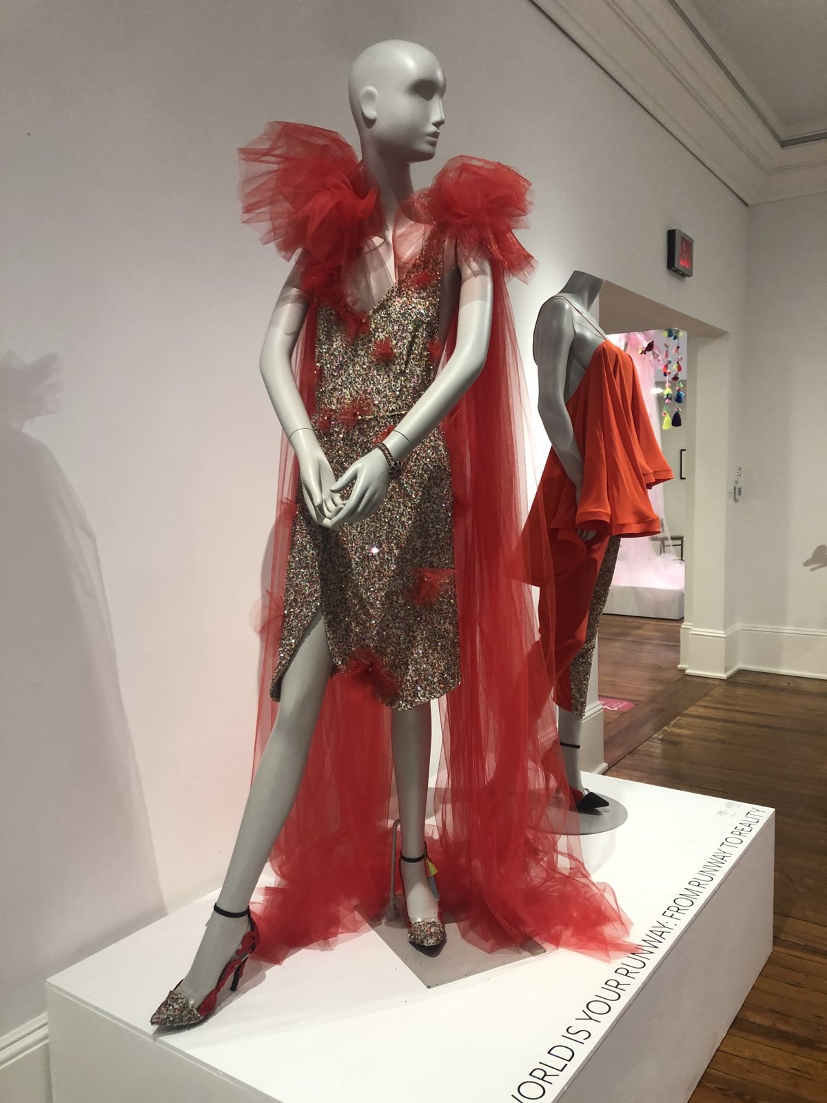 Sequin dress with a red tulle cape by Amanda Perna