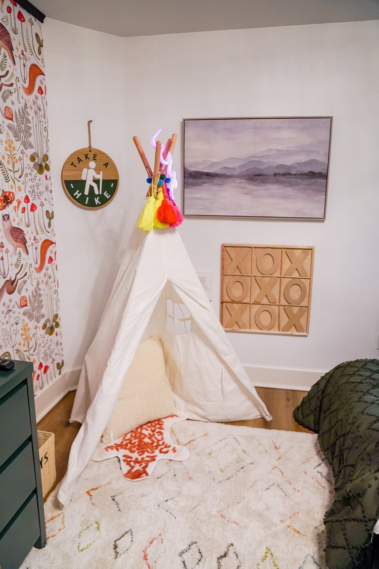 A reading nook with a teepee at The Fernwood