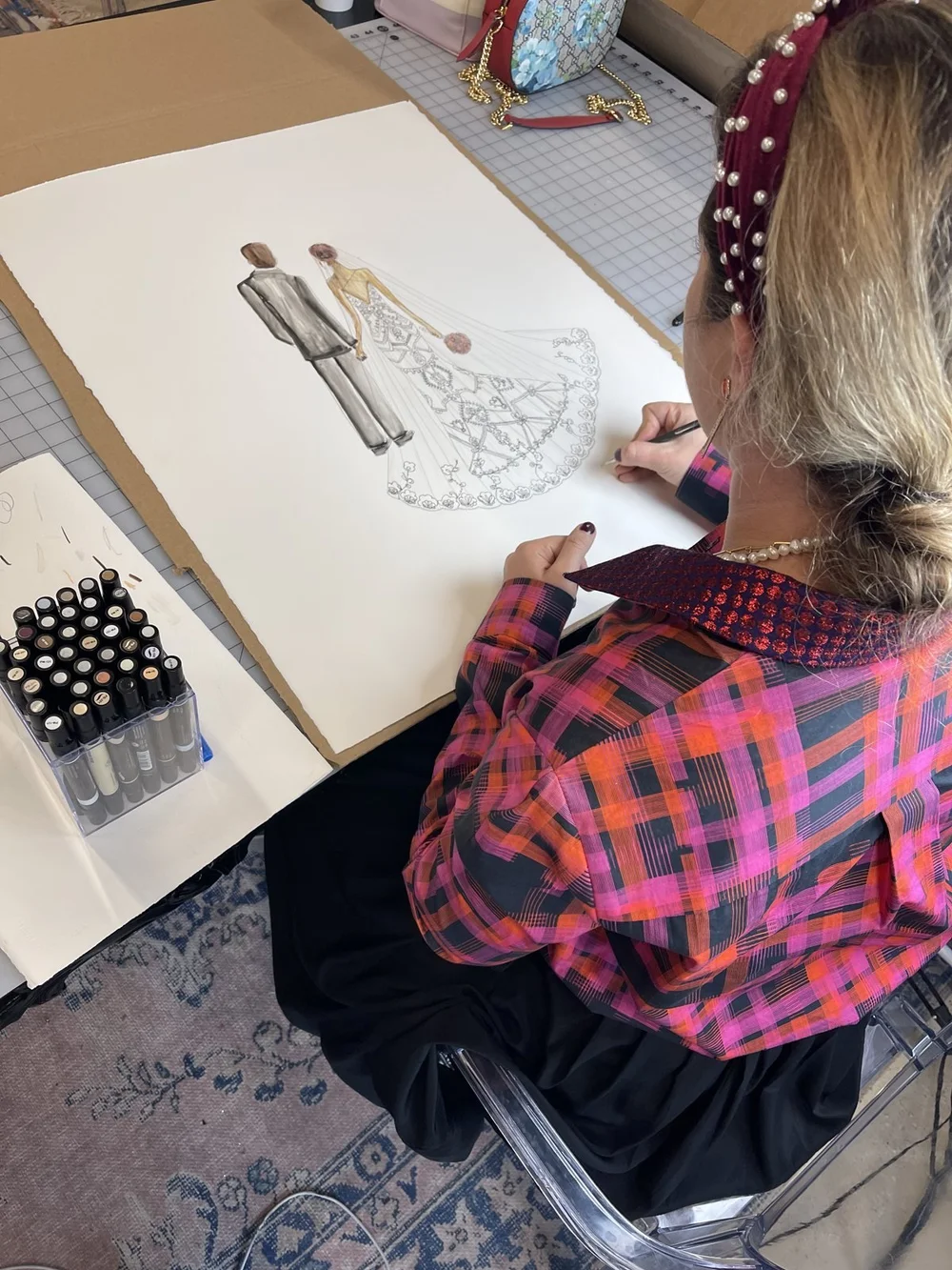 Amanda Perna drawing a custom bride and groom wedding illustration