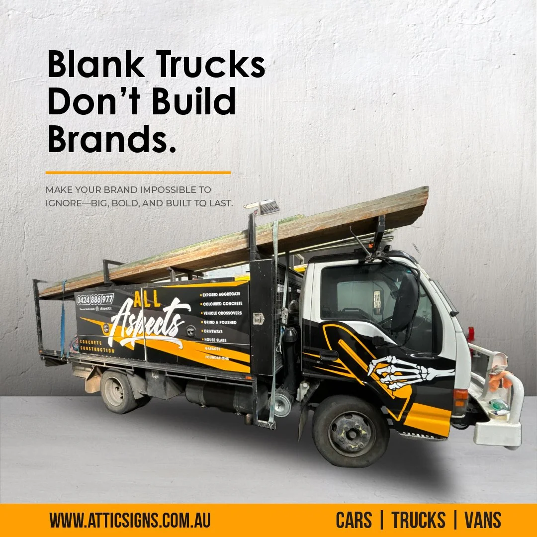 A truck with advertising wrap for All Aspects Concrete Construction parked in front of a plain textured wall. The ad emphasizes building strong brands and includes contact information and services like concrete, driveways, and foundations.
