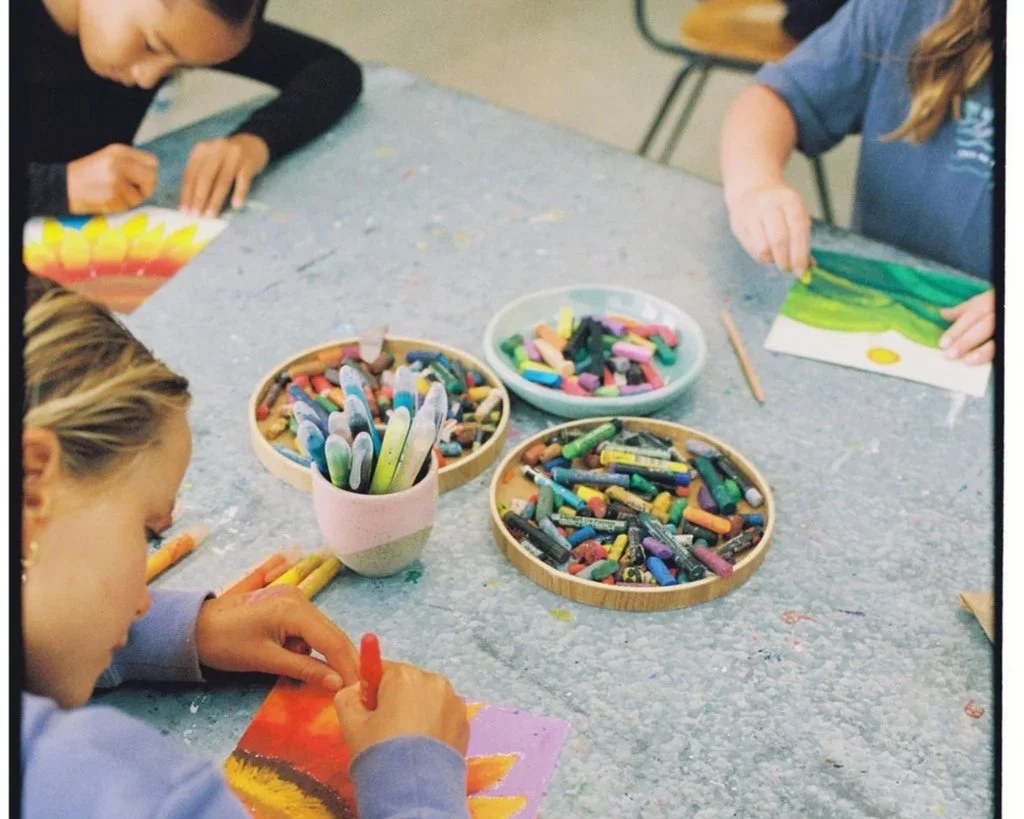 Children creating colourful pastel artworks at Beebops Art School in Torquay