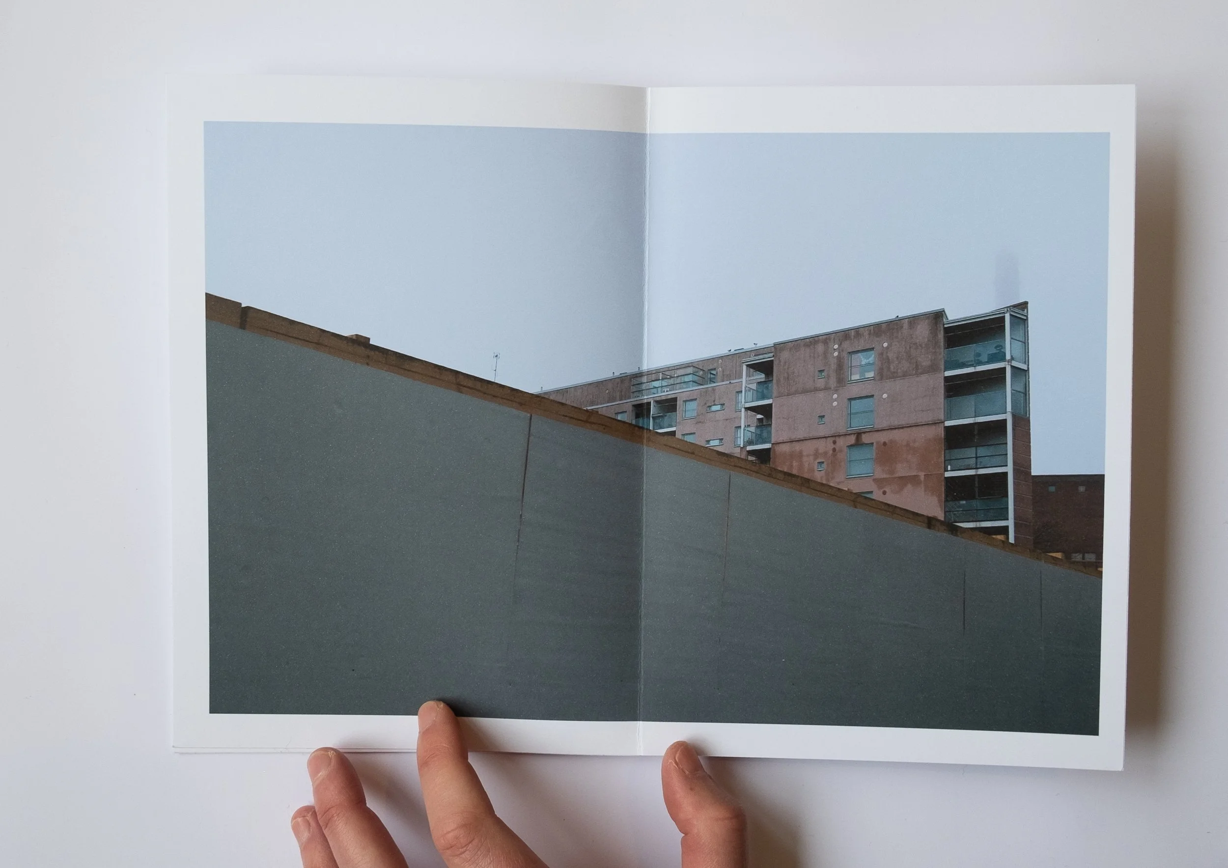 Helsinki photo book building behind a wall