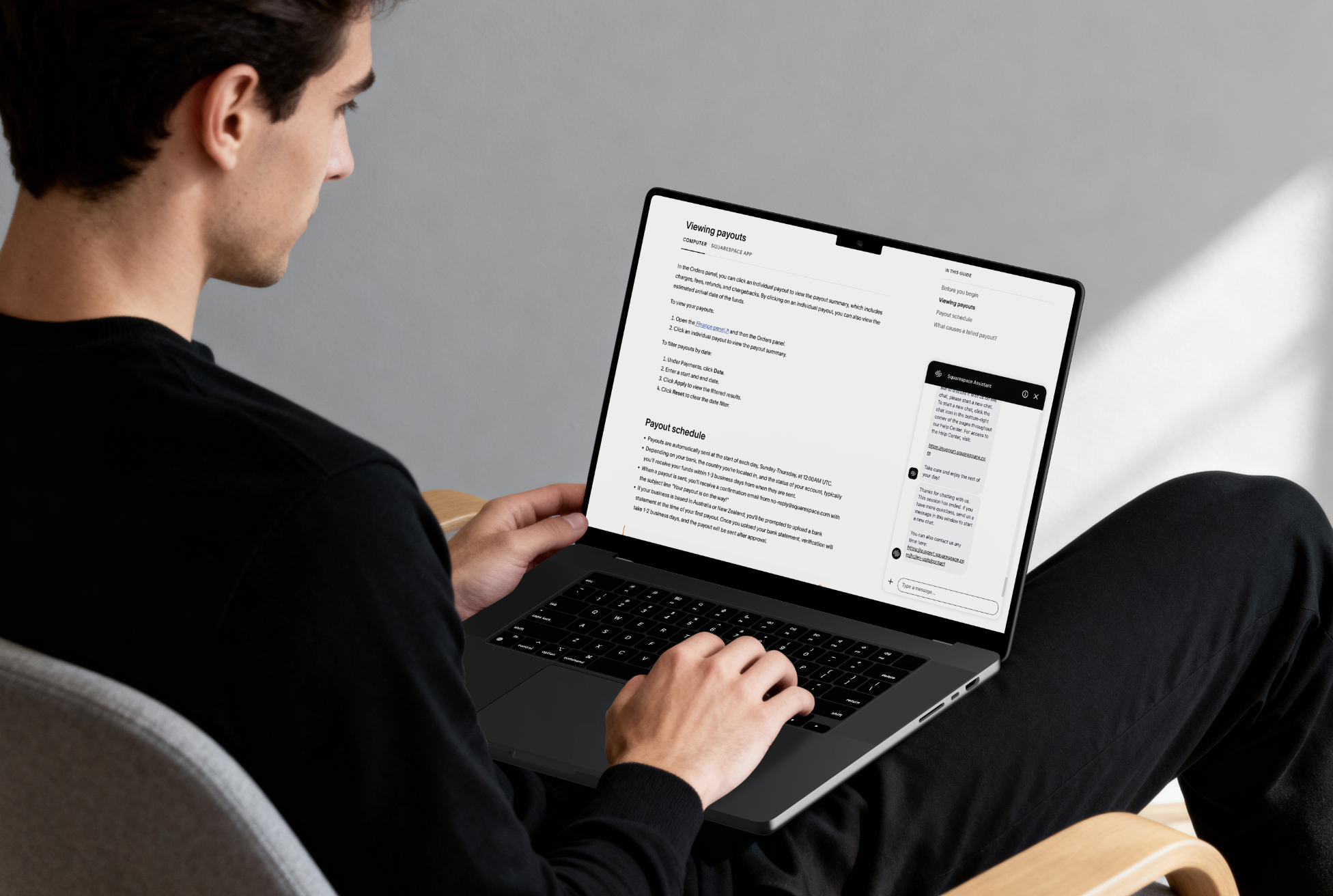 Person using a laptop with a document about 'Viewing payouts' on the screen and a chat window with Support messages.