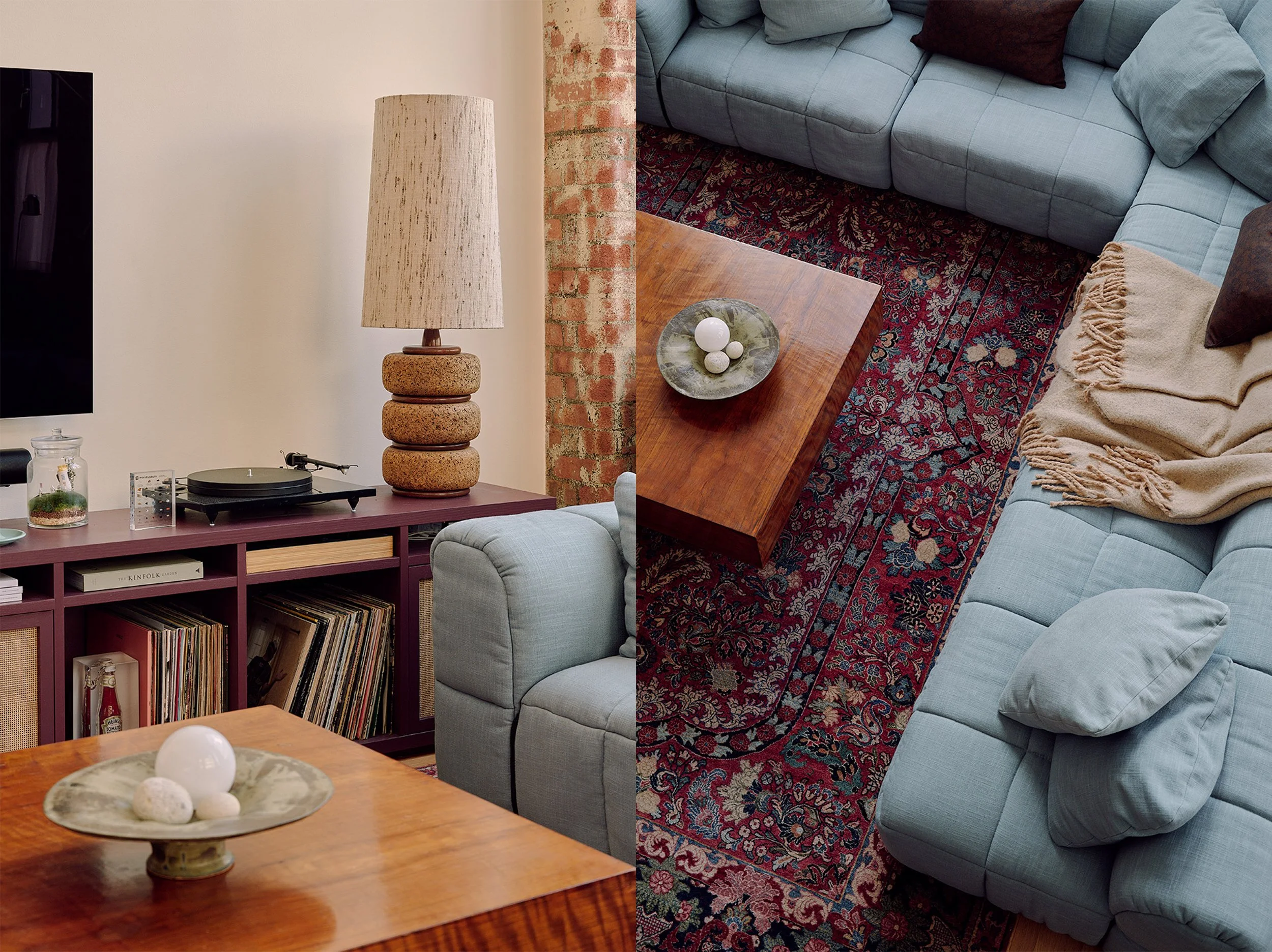 Retro living room with antique Persian rug and cornflower blue Arflex Strips sofa in Farringdon loft, London interior design by Duelle Studio