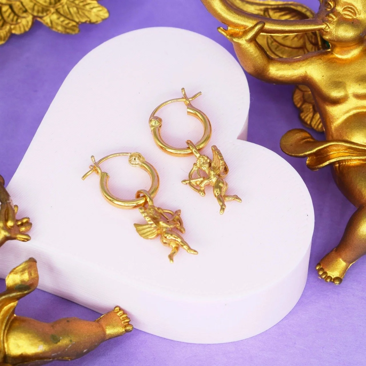 Good Daze Flying Cupid Hoop Earrings with 12mm hoops and 14mm 3D Cupid charm, available in sterling silver or 18k gold vermeil, ethically made in East London and gift wrapped with Goosebump ring box.
