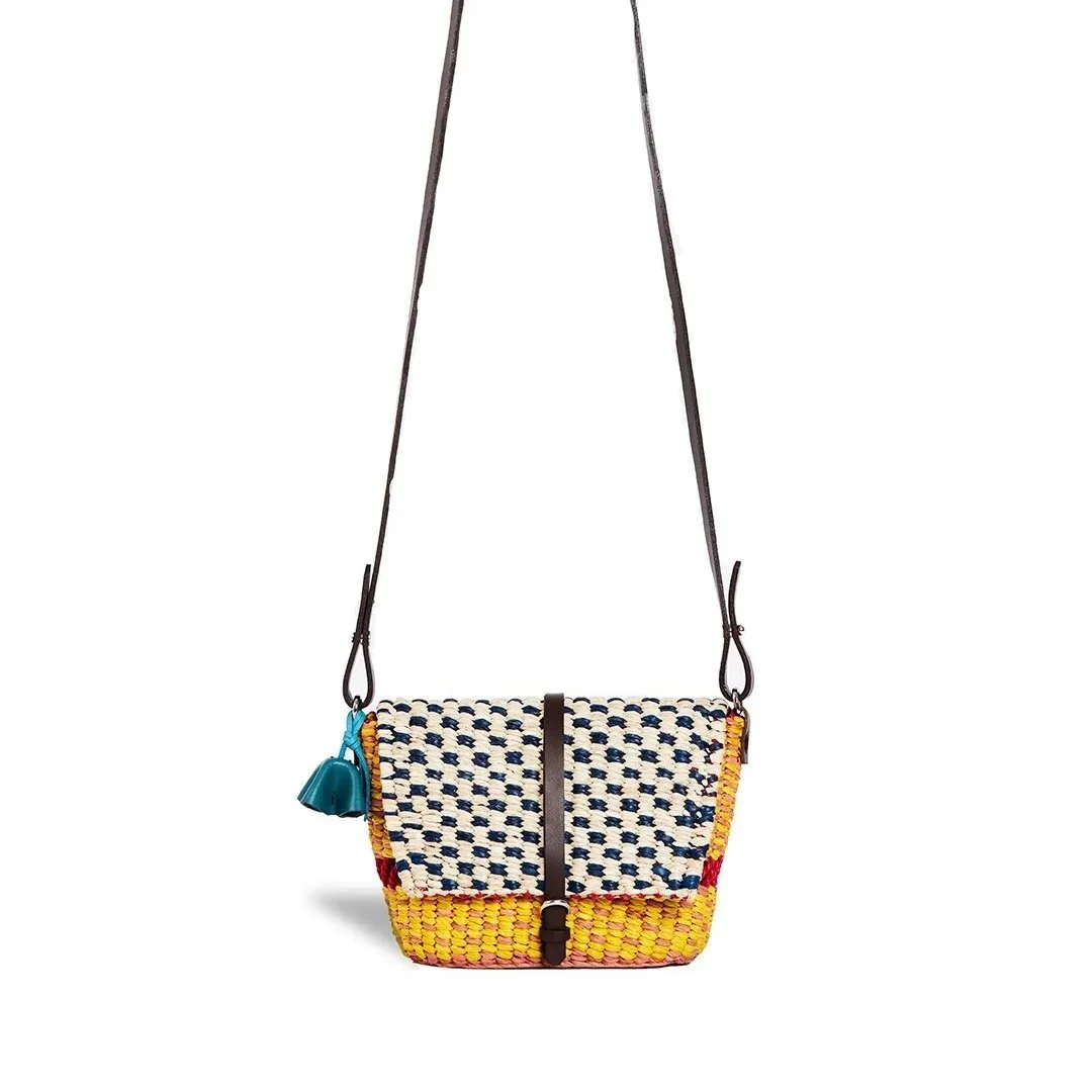 AAKS BIKA YELLOW mini raffia crossbody bag in vibrant yellow with leather strap and flap closure, handcrafted in Ghana — available at Goosebump.live in Hong Kong.