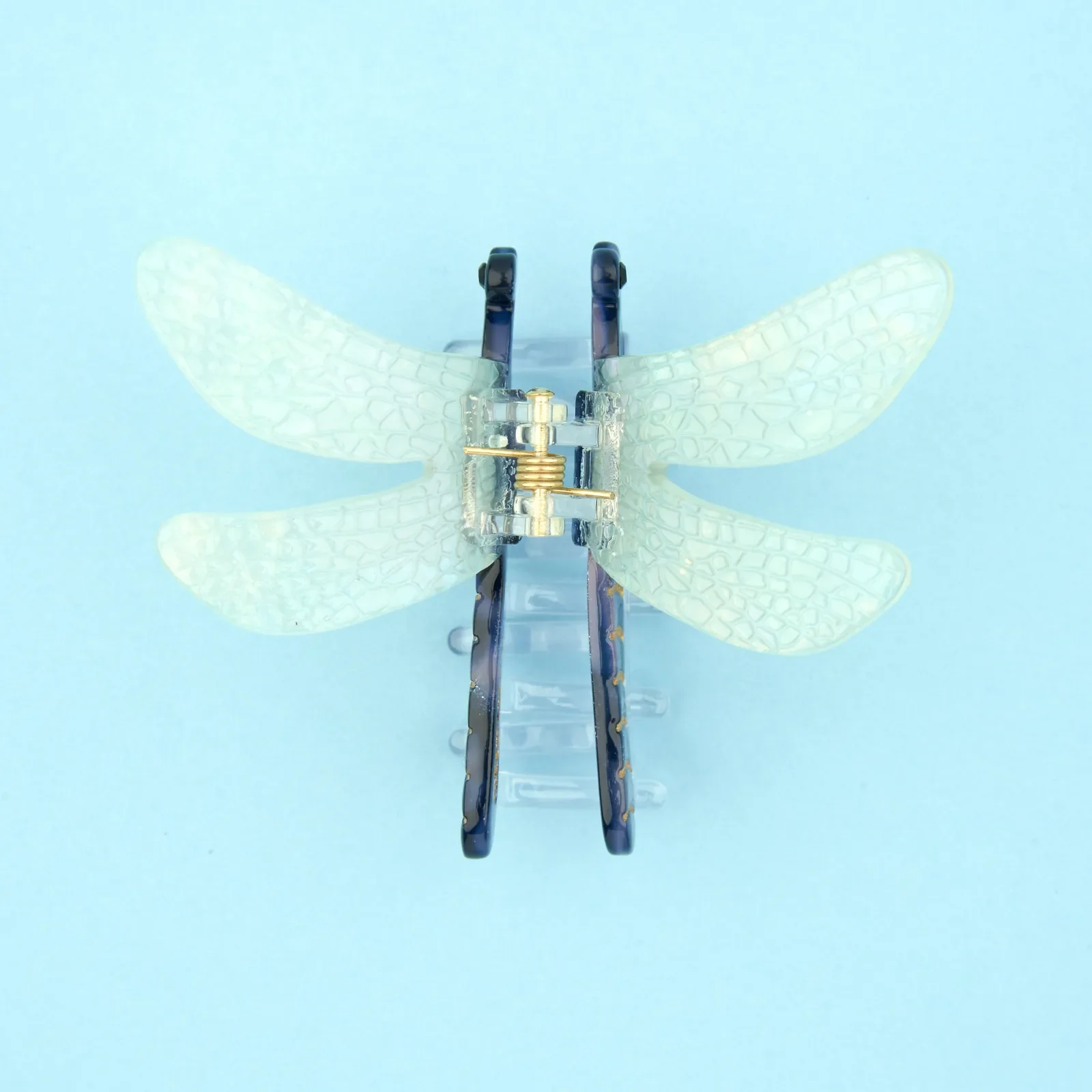 Coucou Suzette Dragonfly Hair Claw in glossy cellulose acetate, a graceful nature-inspired French hair accessory curated by Goosebump.