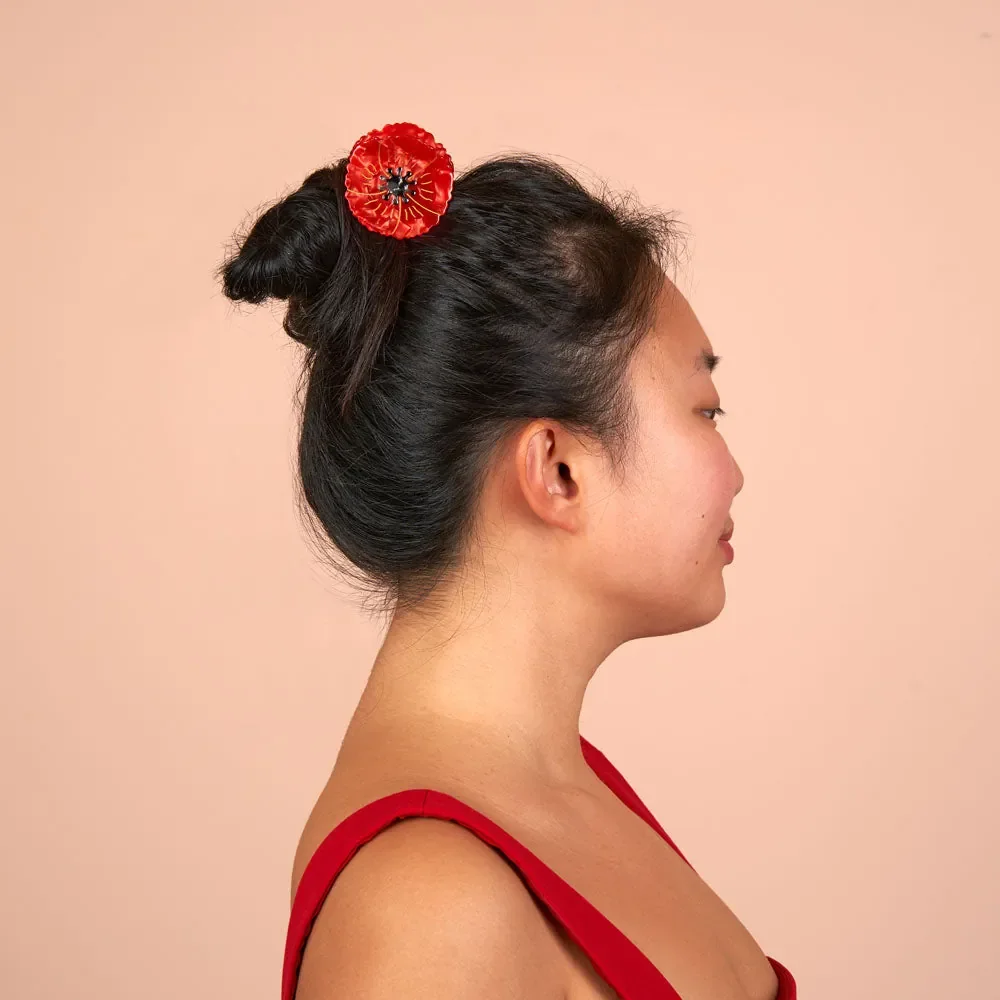 Coucou Suzette Poppy Hair Claw in glossy cellulose acetate, a vivid French flower hair accessory curated by Goosebump.