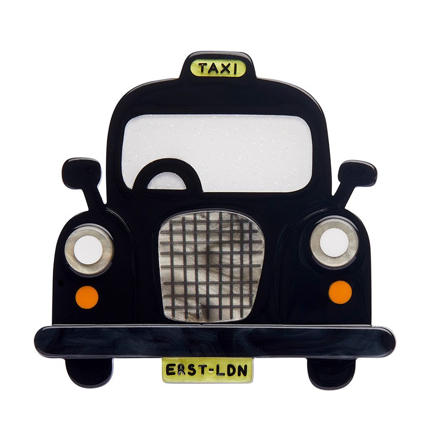 Handcrafted Black Cab Brooch featuring glossy black and glitter white resins. A stylish tribute to London taxis, part of Erstwilder’s London Calling collection.