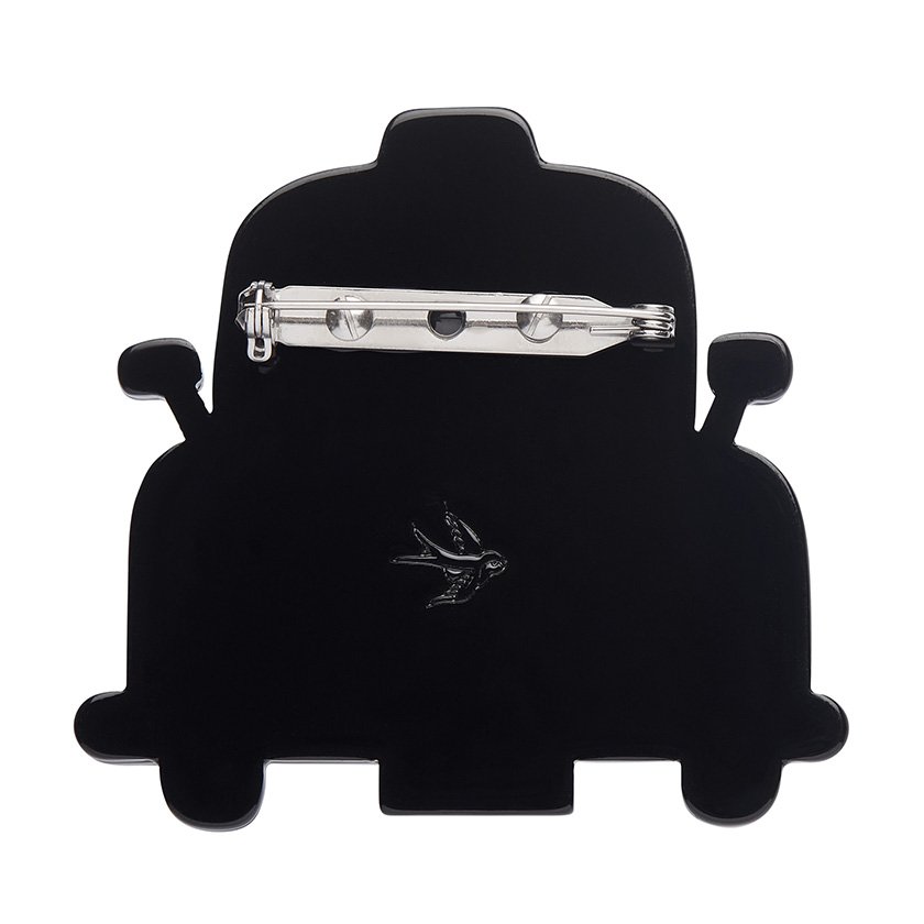Handcrafted Black Cab Brooch featuring glossy black and glitter white resins. A stylish tribute to London taxis, part of Erstwilder’s London Calling collection.