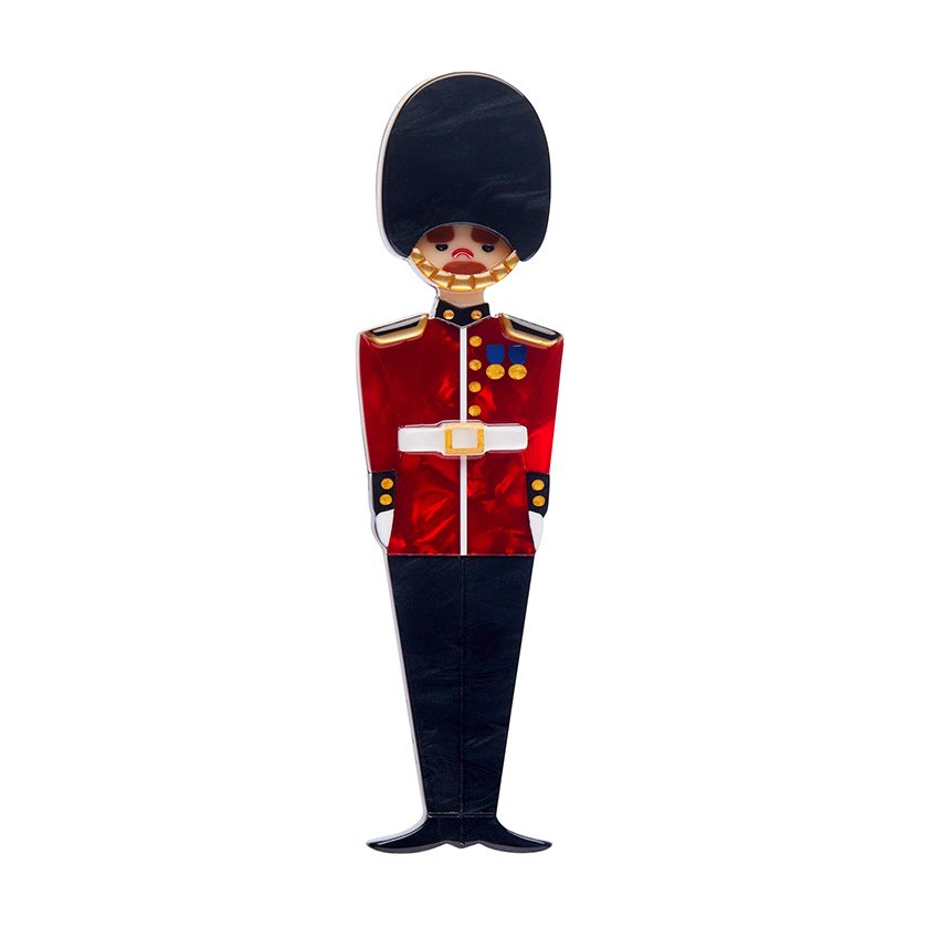 Handcrafted Changing of the Guard Brooch featuring rich red and black resins with etched detailing – a perfect accessory for Anglophiles and collectors of British-themed wearable art.