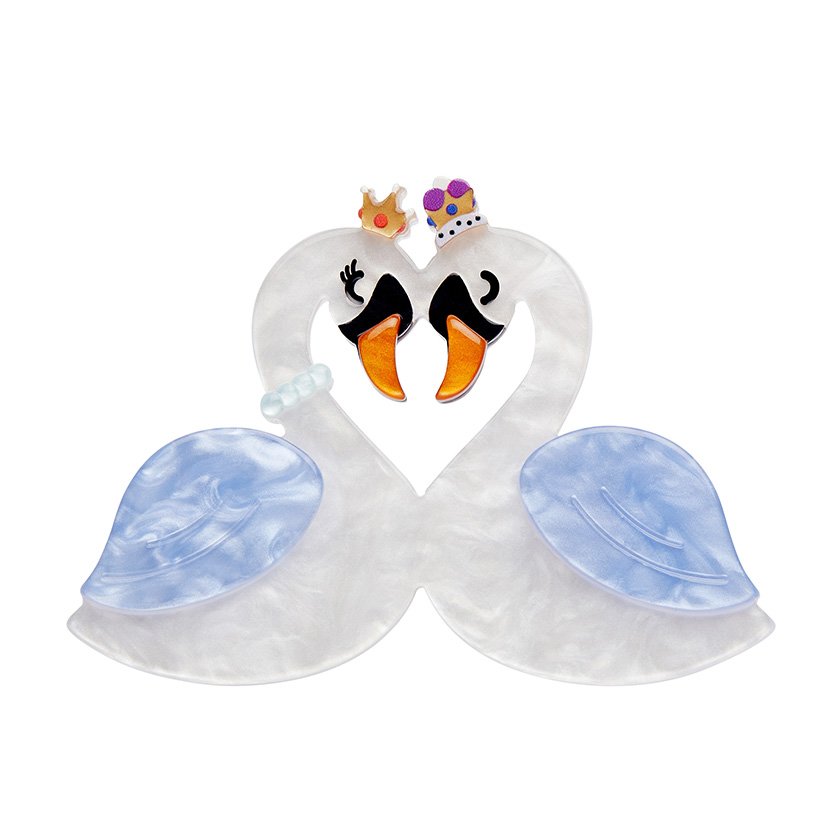A romantic Swan Love Brooch featuring white and blue textured resin, heart-shaped swans, and crown accents. Part of Erstwilder's London Calling collection, perfect for brooch collectors in Hong Kong.