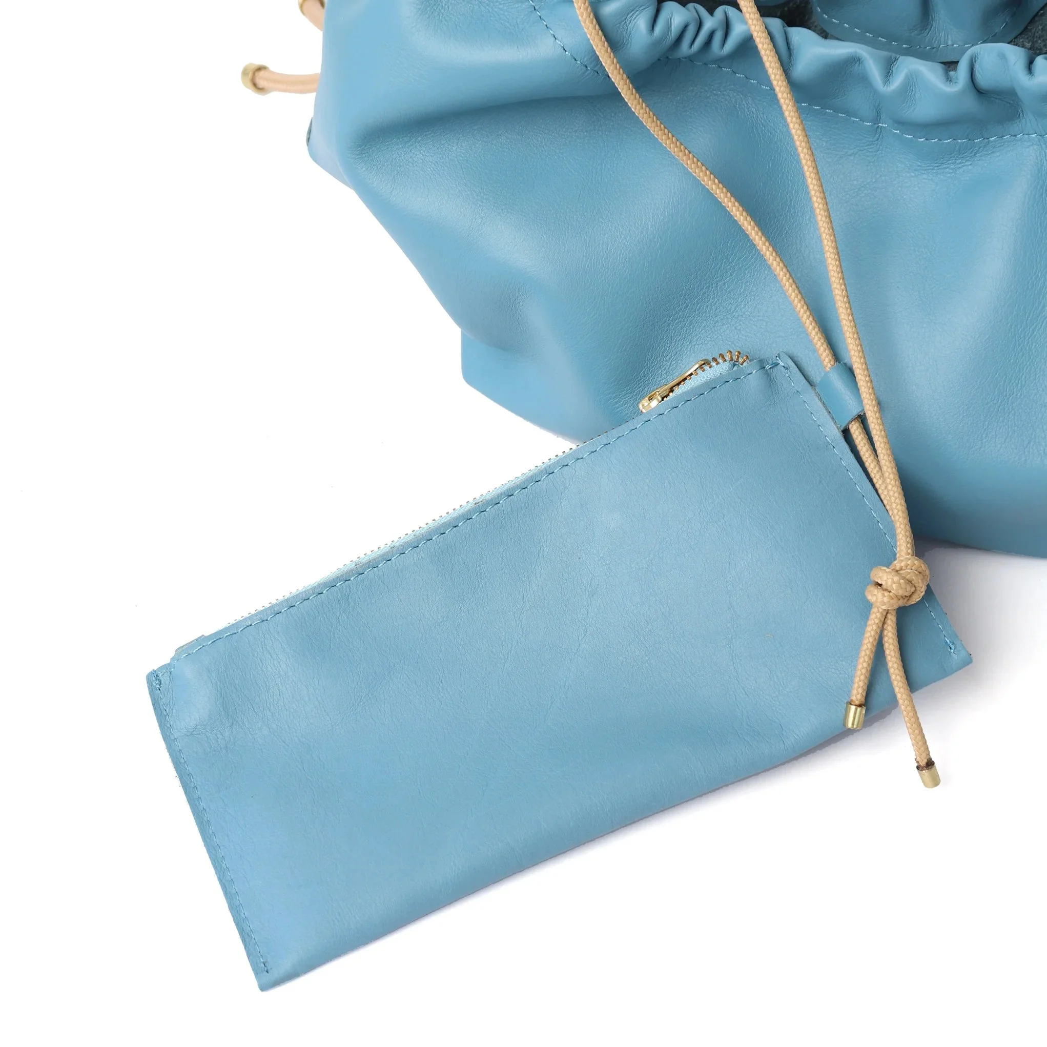 Sky Blue leather Flora Bag with tulip-inspired shape and artisan rope strap by Project Dyad, made in Cape Town.