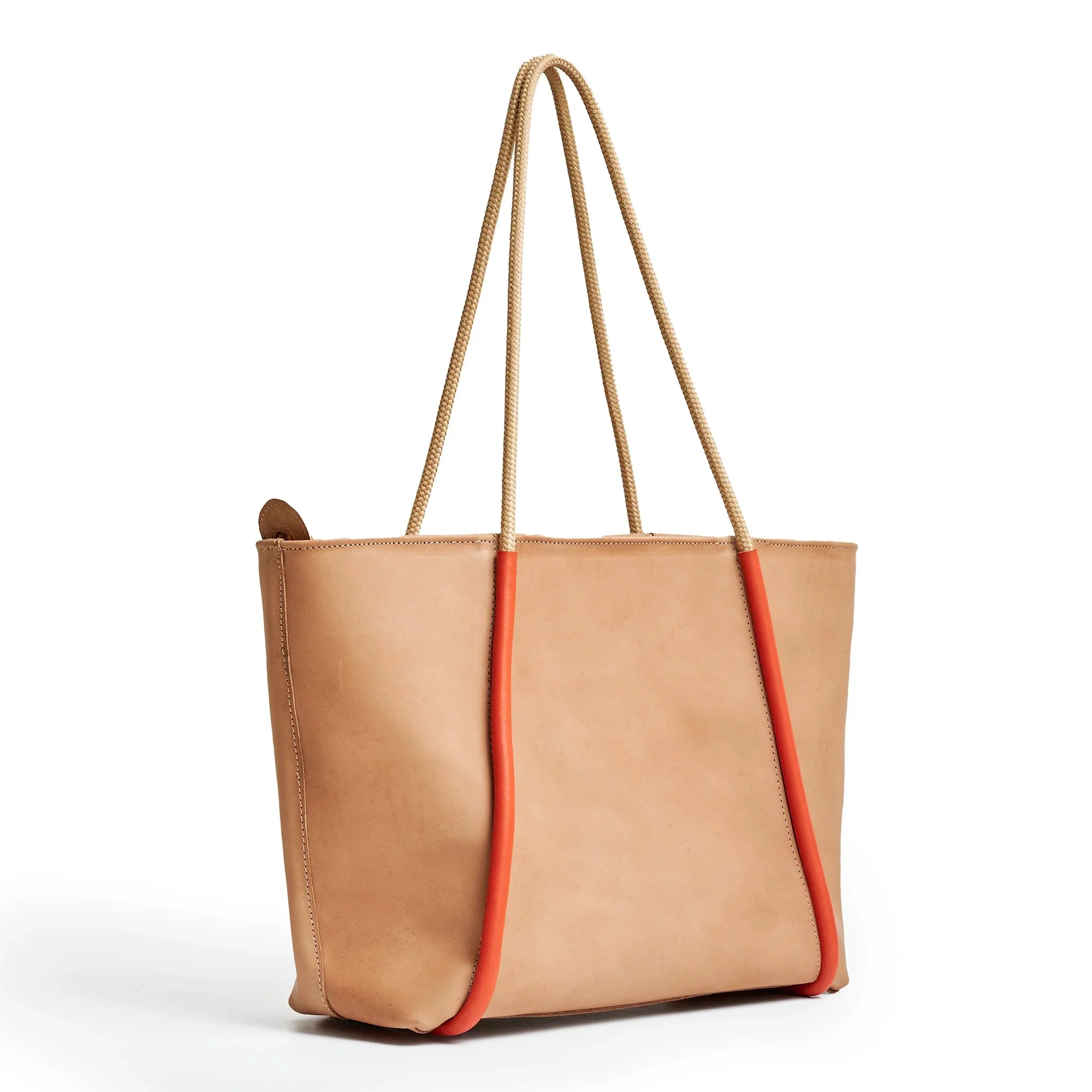 Almond and lobster red colourblock canvas tote bag by Project Dyad, boxy silhouette with cream handles, 46.5cm wide with long shoulder straps.