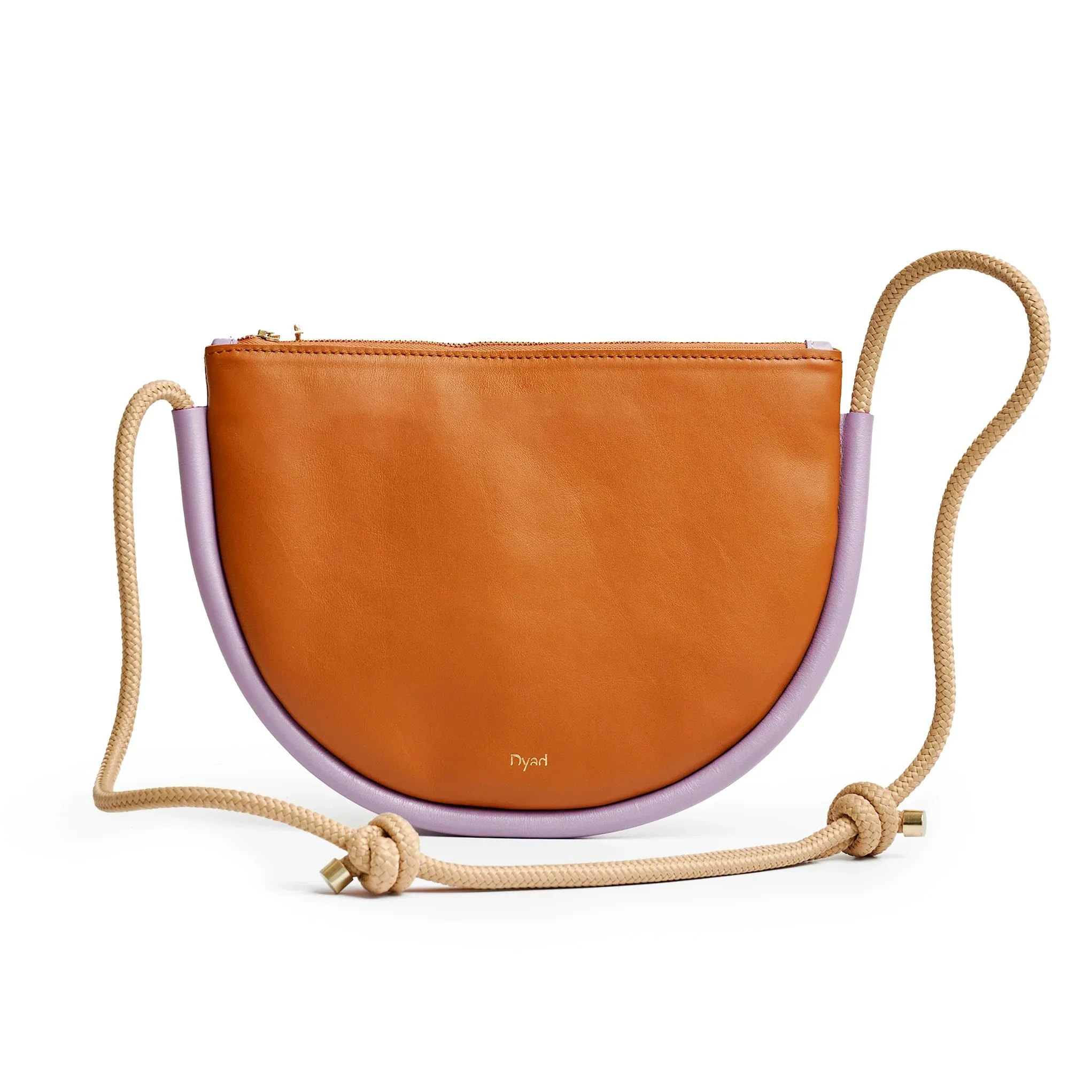 Selene Bag in tan and lilac colourway, sculptural folded silhouette with rope strap and short handles, handcrafted in South Africa.