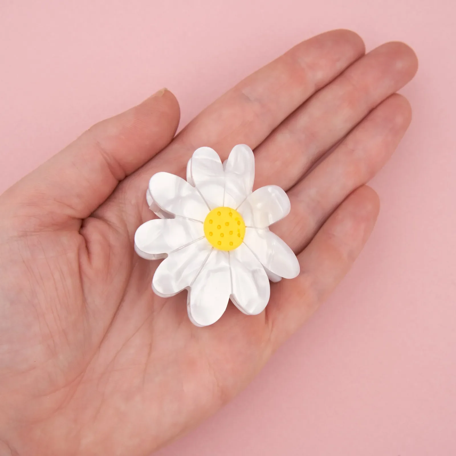 Coucou Suzette Daisy Hair Claw in glossy cellulose acetate, a sweet French flower hair accessory curated by Goosebump.