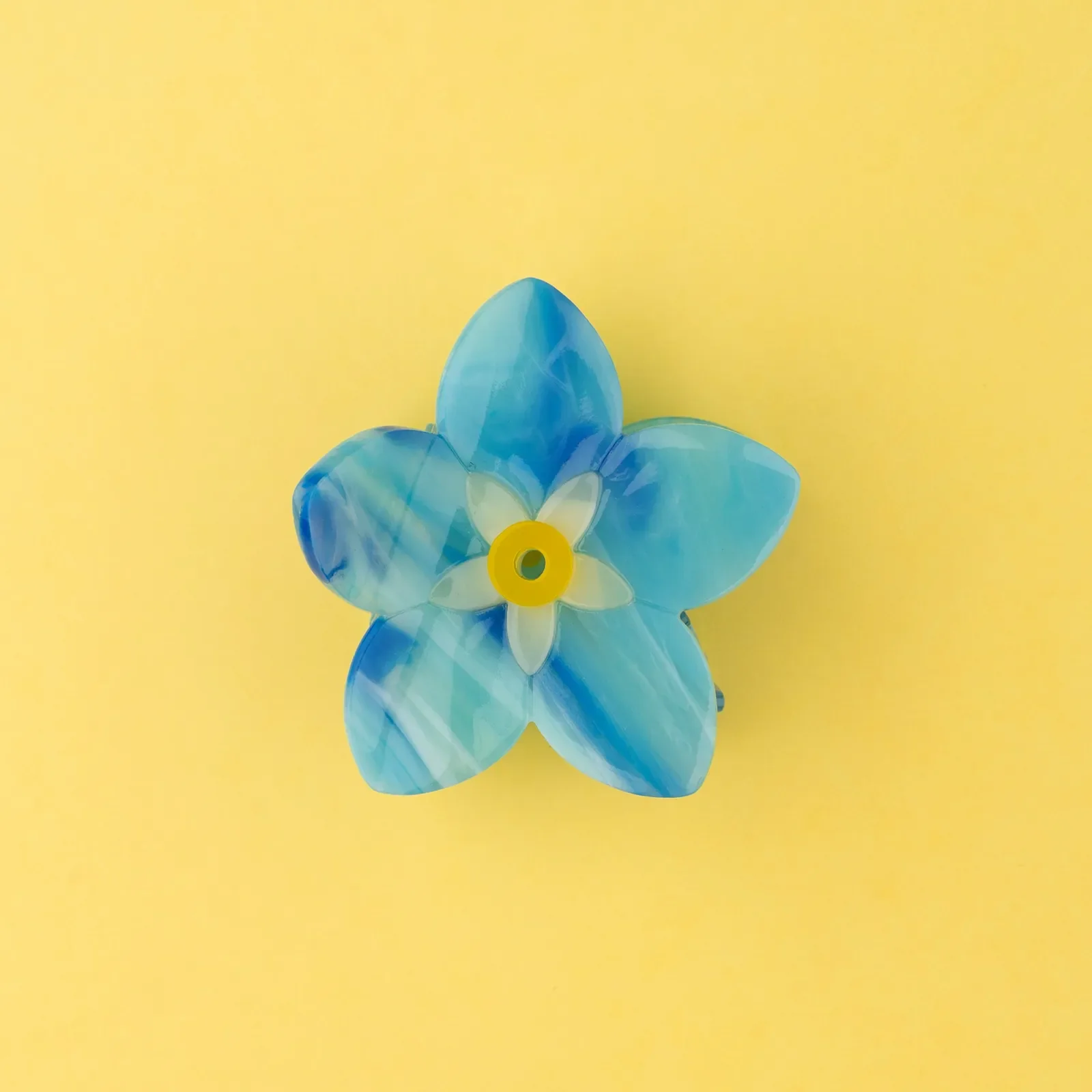 Coucou Suzette Forget-Me-Not Hair Claw in glossy cellulose acetate, a delicate French flower hair accessory curated by Goosebump.
