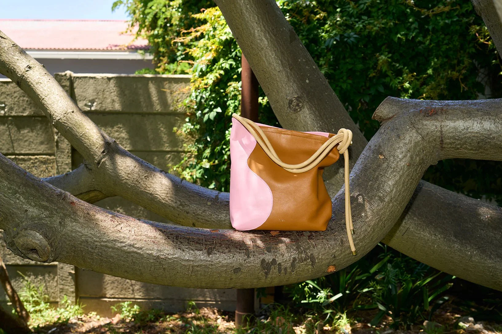 Tan and candy pink ripple canvas tote bag by Project Dyad, handmade in Cape Town with sculptural folds and cotton straps.