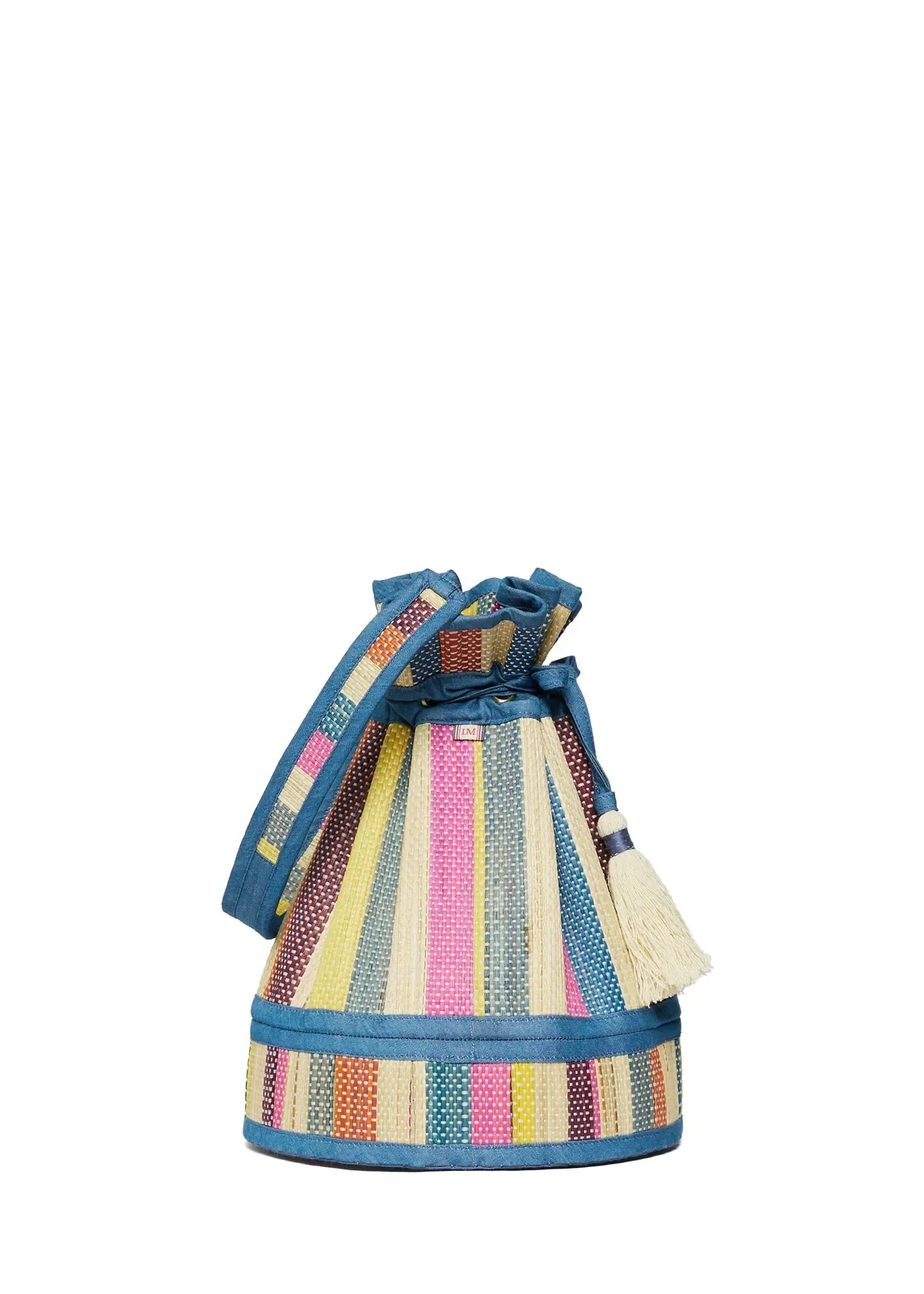 Side profile of the Lorna Murray Nassau Midi Leisure Tote highlighting its structured drawstring silhouette.