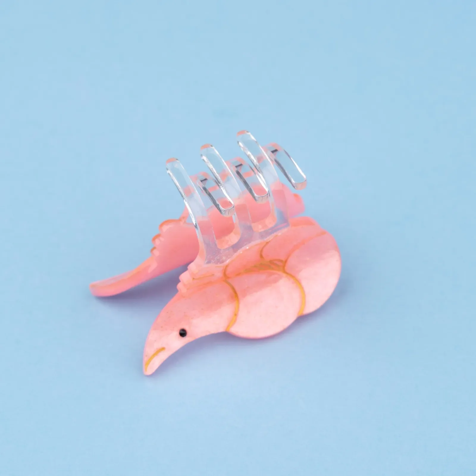 Coucou Suzette Mini Shrimp Hair Claw in glossy cellulose acetate, a quirky sea-inspired French hair accessory curated by Goosebump.