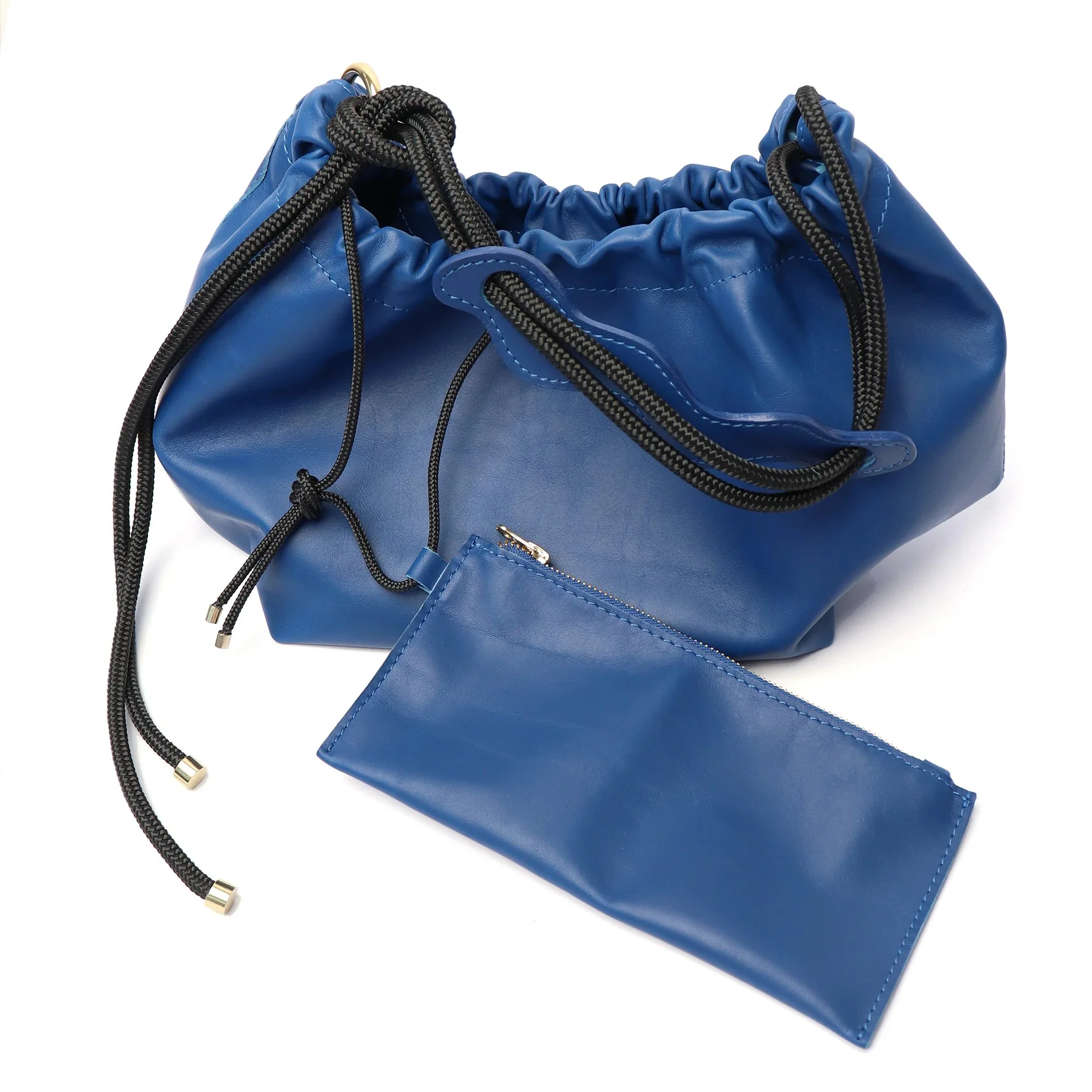 Bold cobalt blue Flora Bag with tulip-style shape and handcrafted leather detail by Project Dyad.