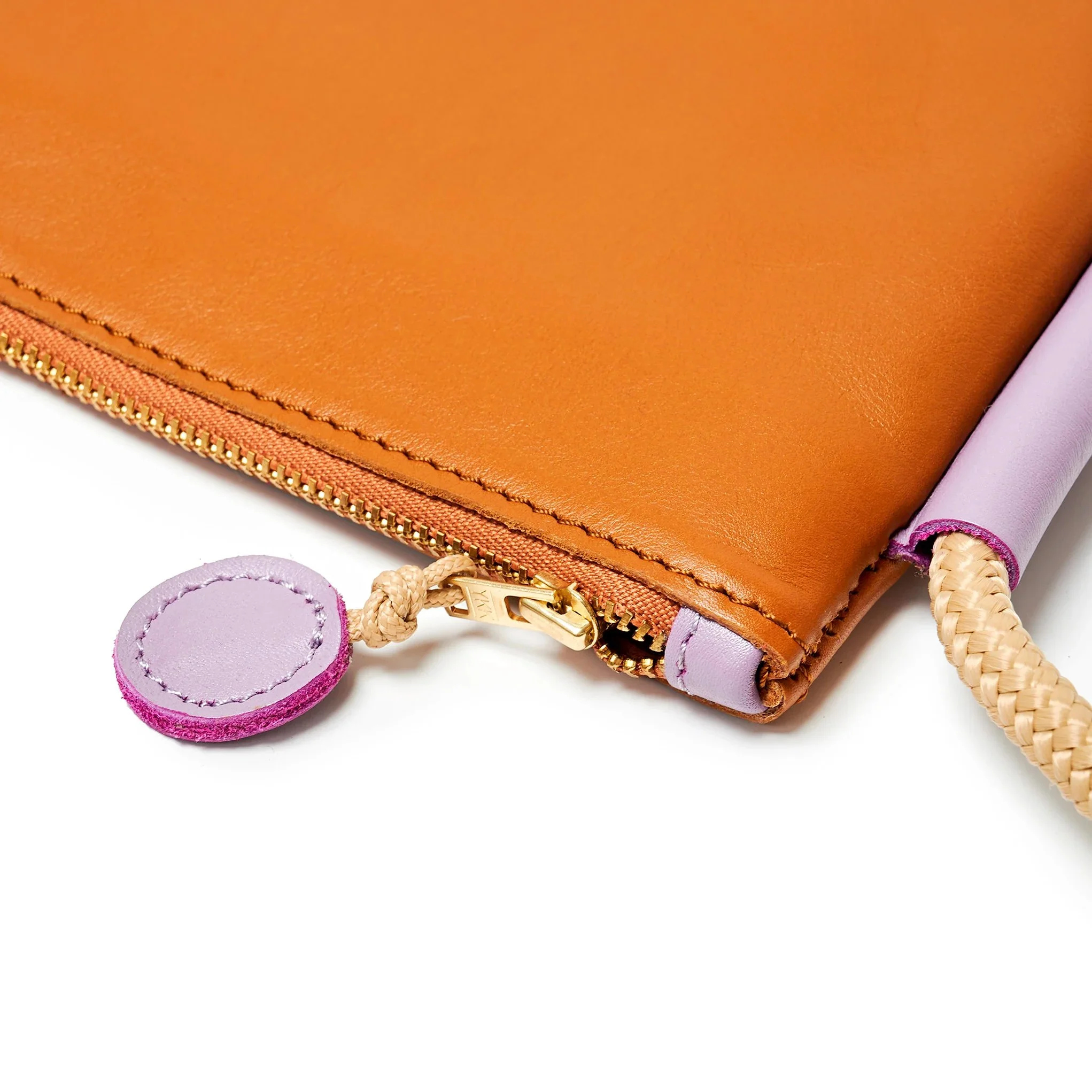 Selene Bag in tan and lilac colourway, sculptural folded silhouette with rope strap and short handles, handcrafted in South Africa.