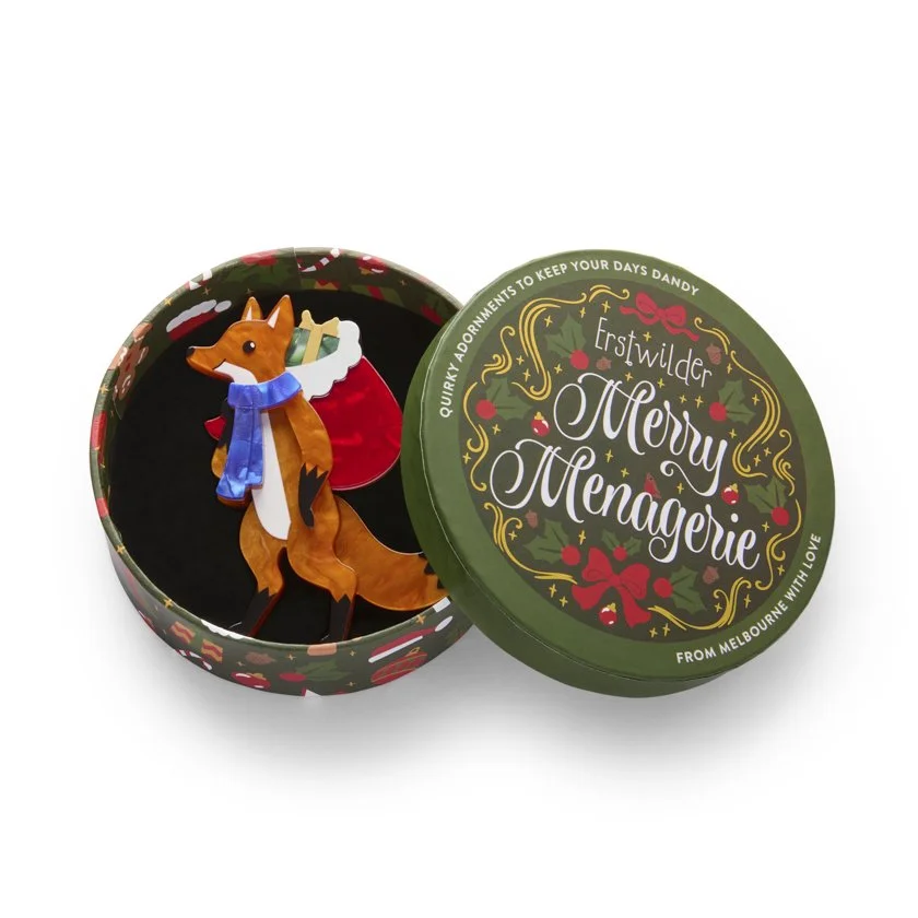 Erstwilder Freddy the Fox Brooch with layered amber resin, red gift sack, and winter scarf. Perfect festive accessory for Hong Kong brooch lovers and whimsical gift givers.
