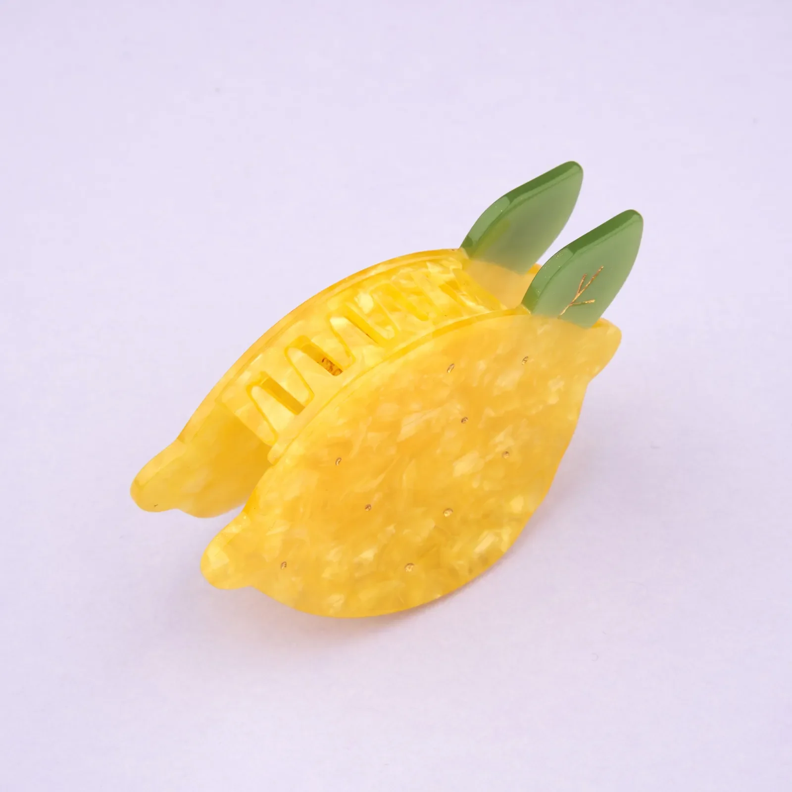 Coucou Suzette Lemon Hair Claw in glossy cellulose acetate, a cheerful French fruit-inspired hair accessory curated by Goosebump.