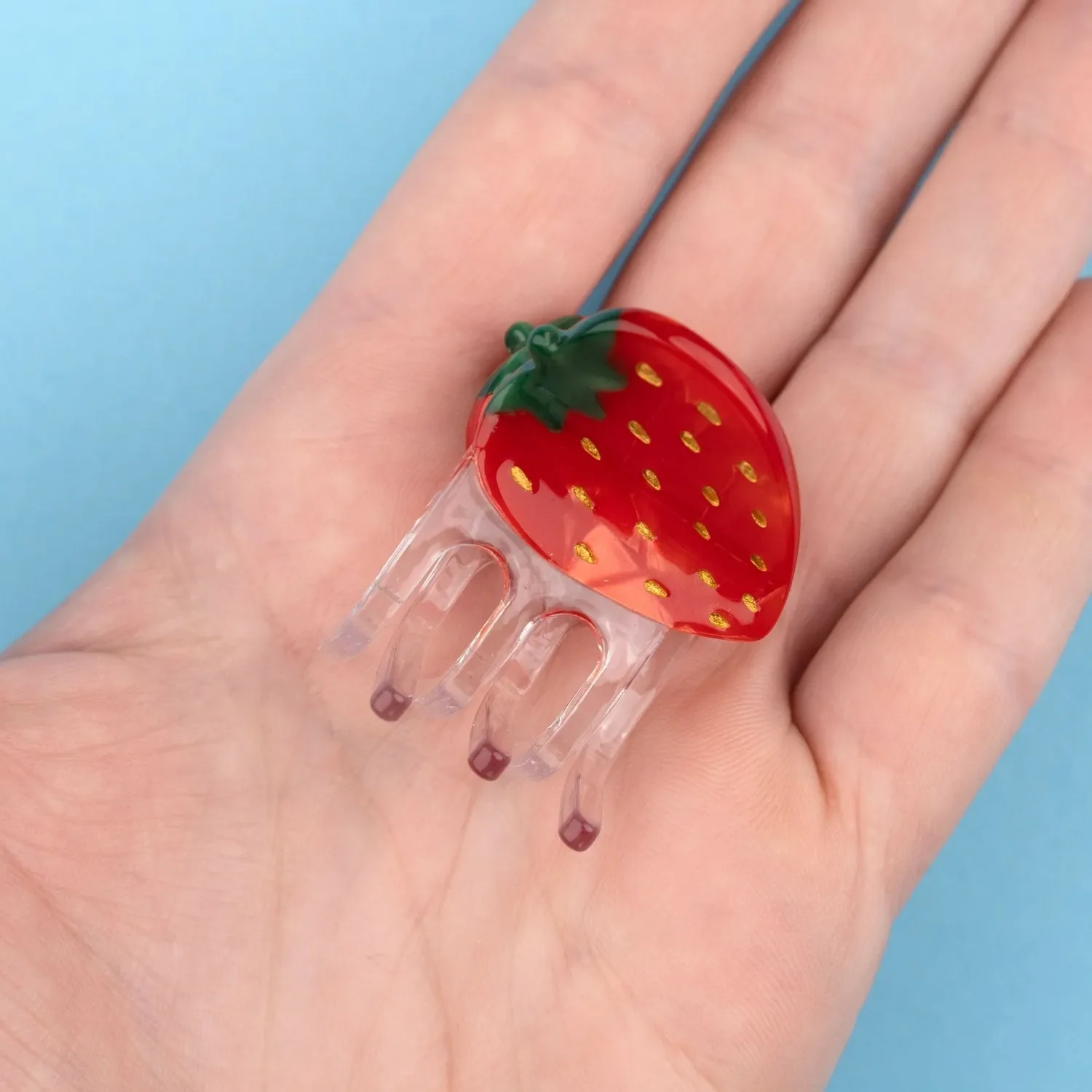 Coucou Suzette Mini Strawberry Hair Claw in glossy cellulose acetate, a playful French fruit-inspired hair accessory curated by Goosebump.