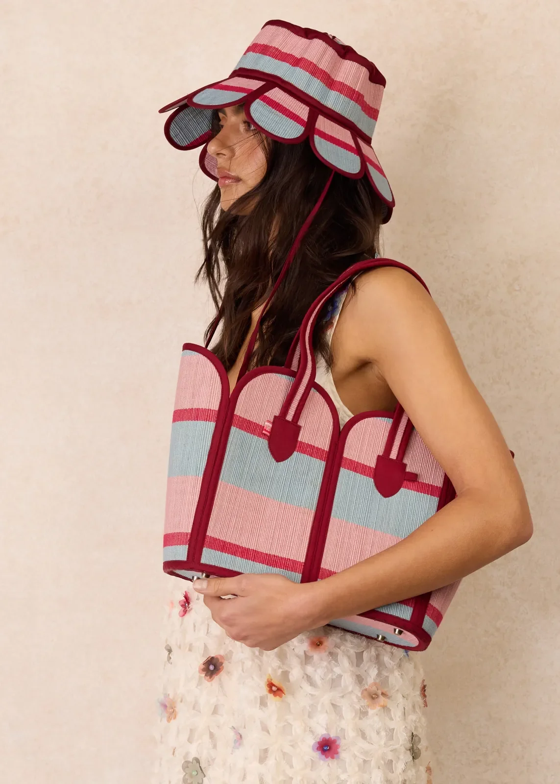 Model carrying the Lorna Murray Escape Vacation Tote over the shoulder, showcasing its lightweight handcrafted design.