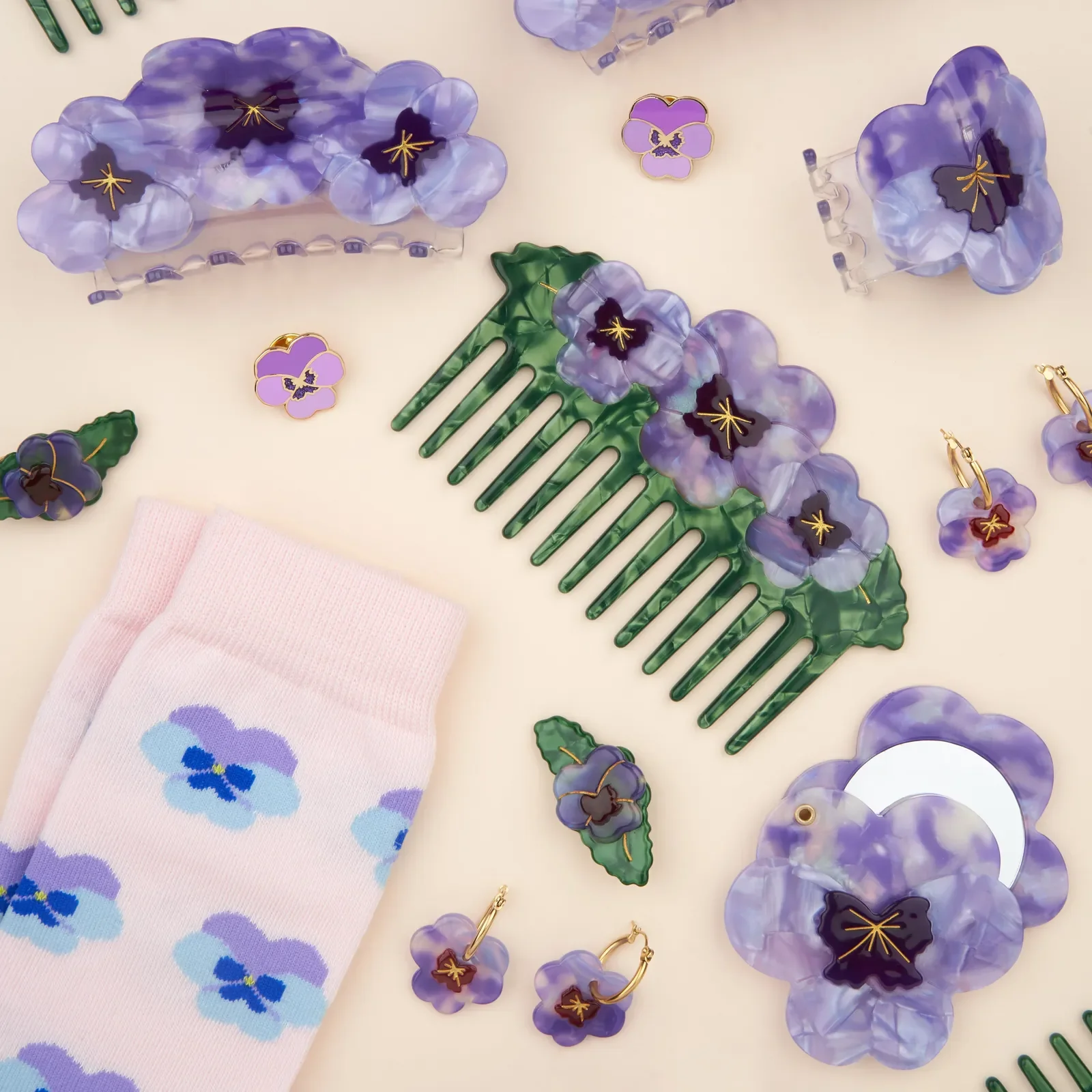 Coucou Suzette Pansy Hair Claw in glossy cellulose acetate, a delicate French flower hair accessory curated by Goosebump.