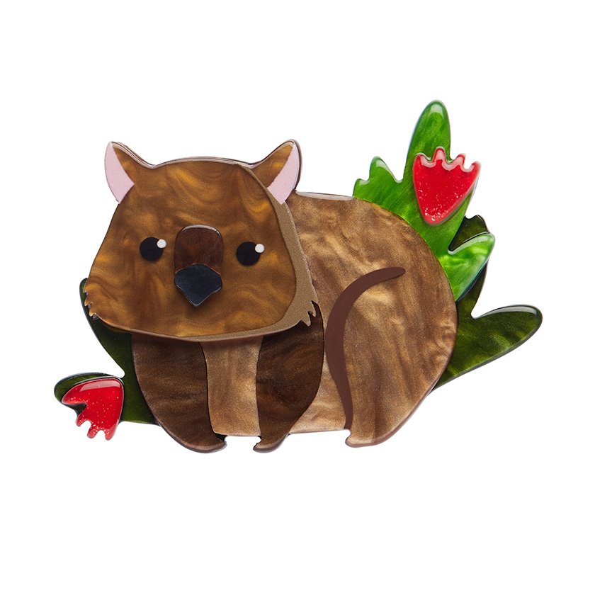 Front view of Nibbles the Wombat Brooch, showcasing contrasting brown resins with red and green fauna details and hand-painted accents.