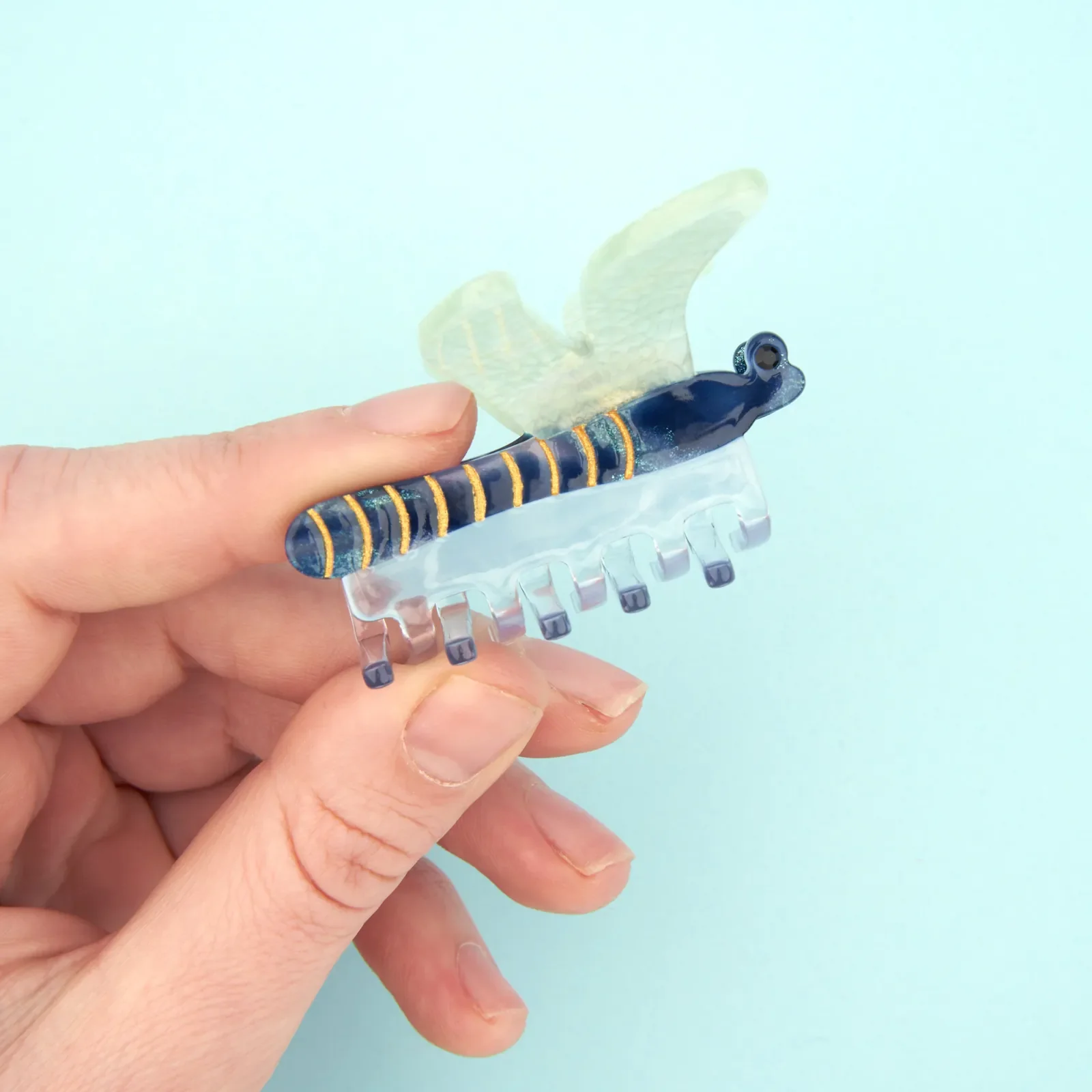Coucou Suzette Dragonfly Hair Claw in glossy cellulose acetate, a graceful nature-inspired French hair accessory curated by Goosebump.