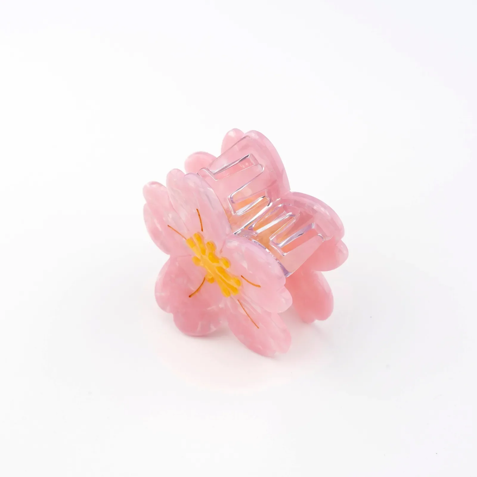 Coucou Suzette Sakura Hair Claw in glossy cellulose acetate, a delicate French flower hair accessory curated by Goosebump.