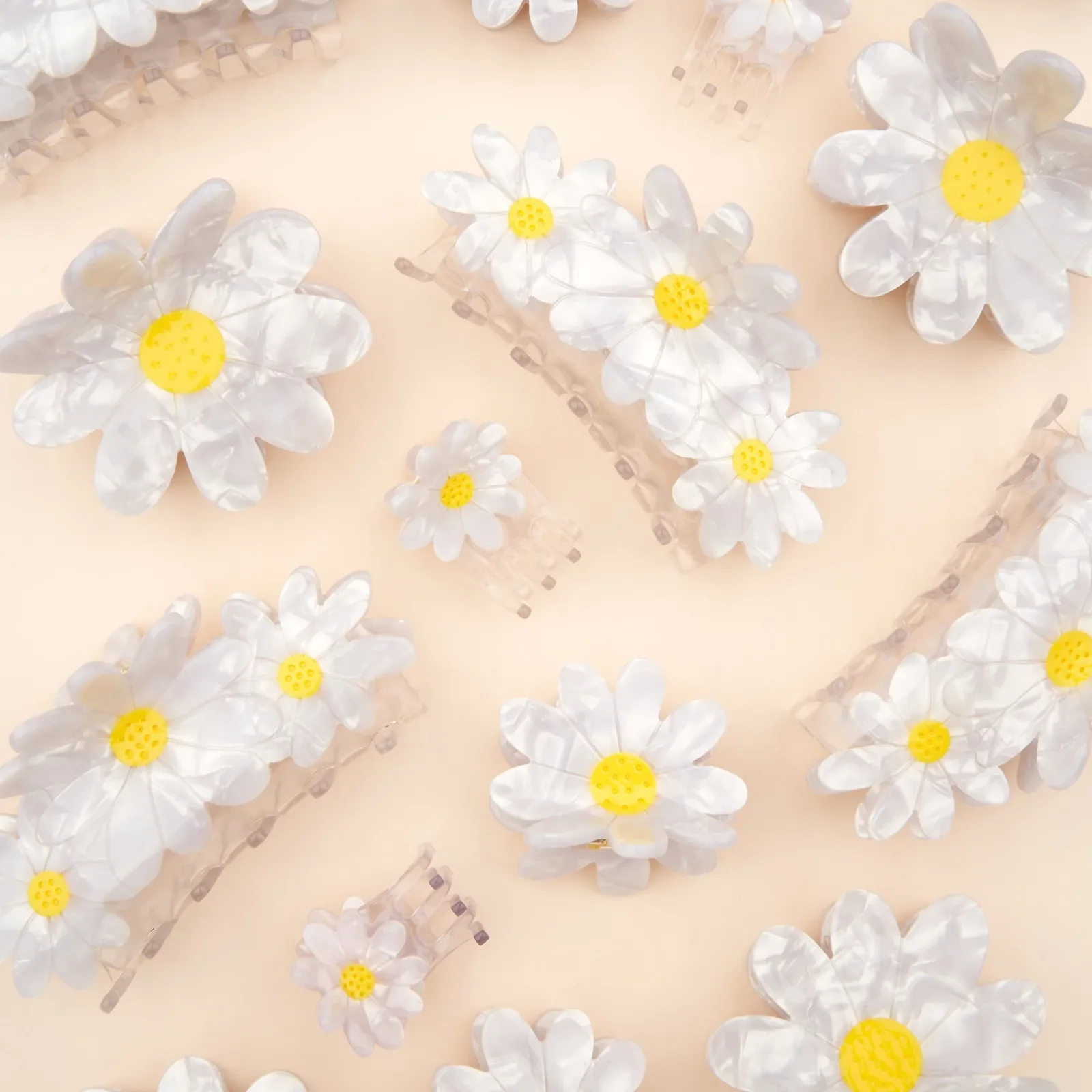 Coucou Suzette Daisy Hair Claw in glossy cellulose acetate, a sweet French flower hair accessory curated by Goosebump.