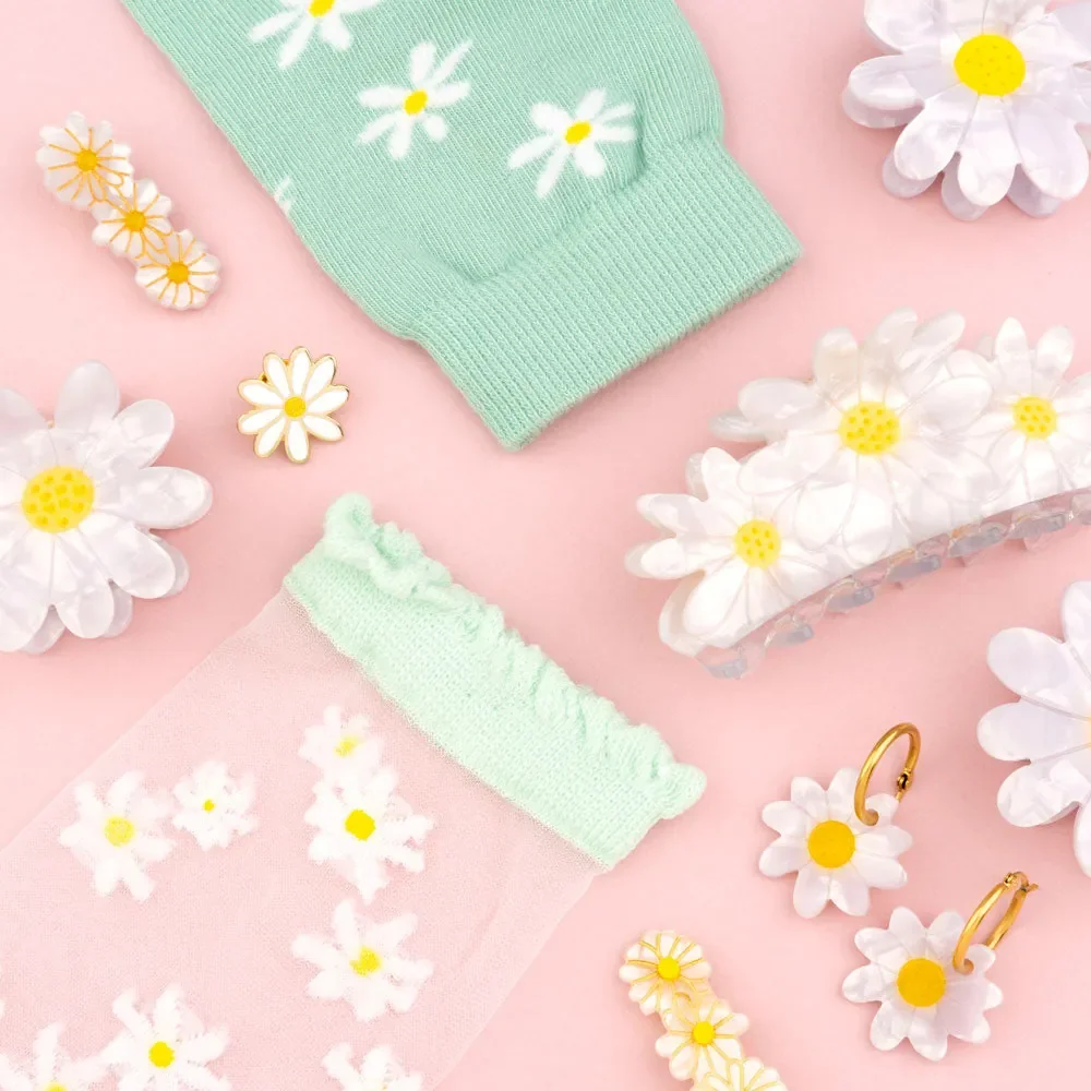 Coucou Suzette Daisy Hair Claw in glossy cellulose acetate, a sweet French flower hair accessory curated by Goosebump.