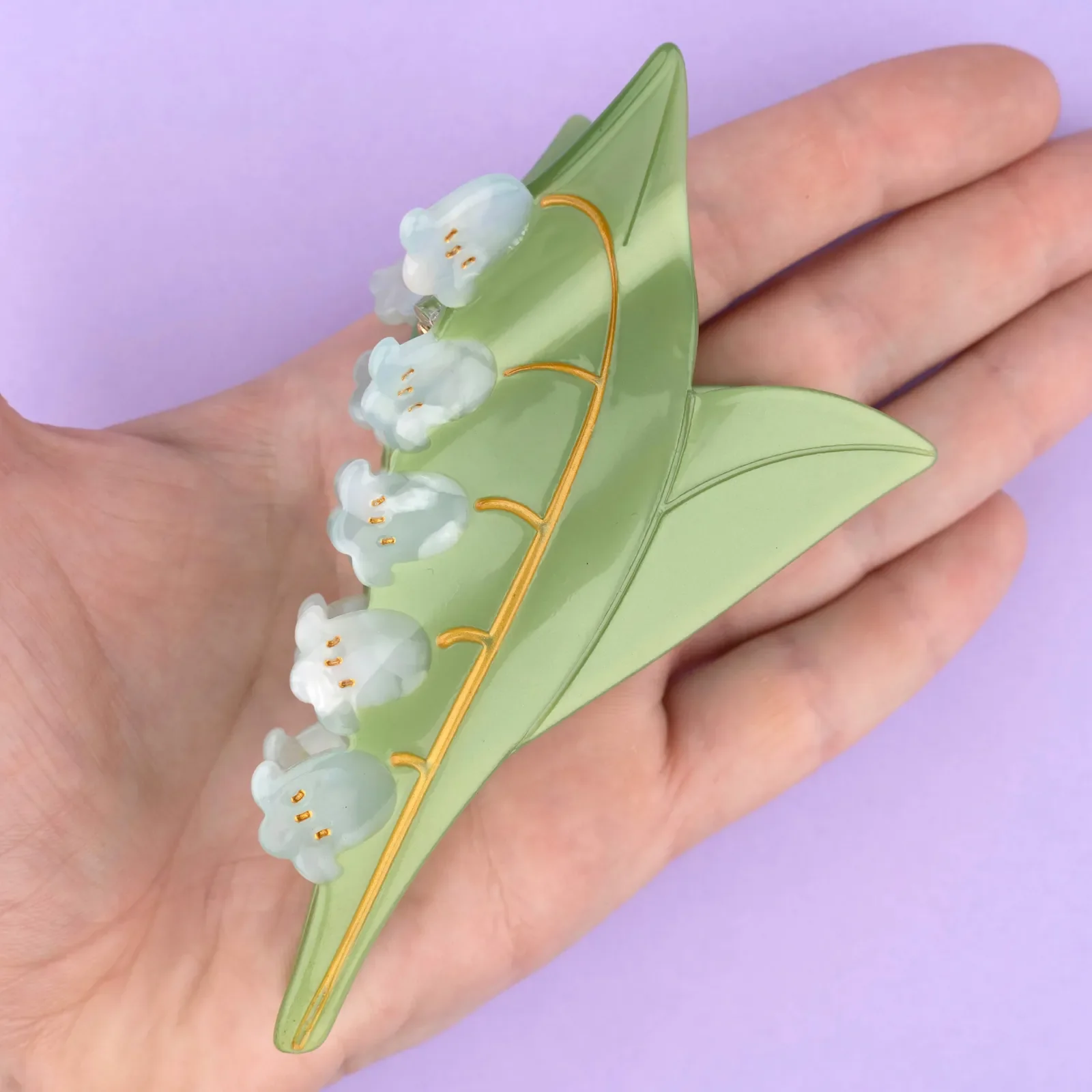 Coucou Suzette Lily of the Valley Hair Claw in glossy cellulose acetate, a delicate French flower hair accessory curated by Goosebump.