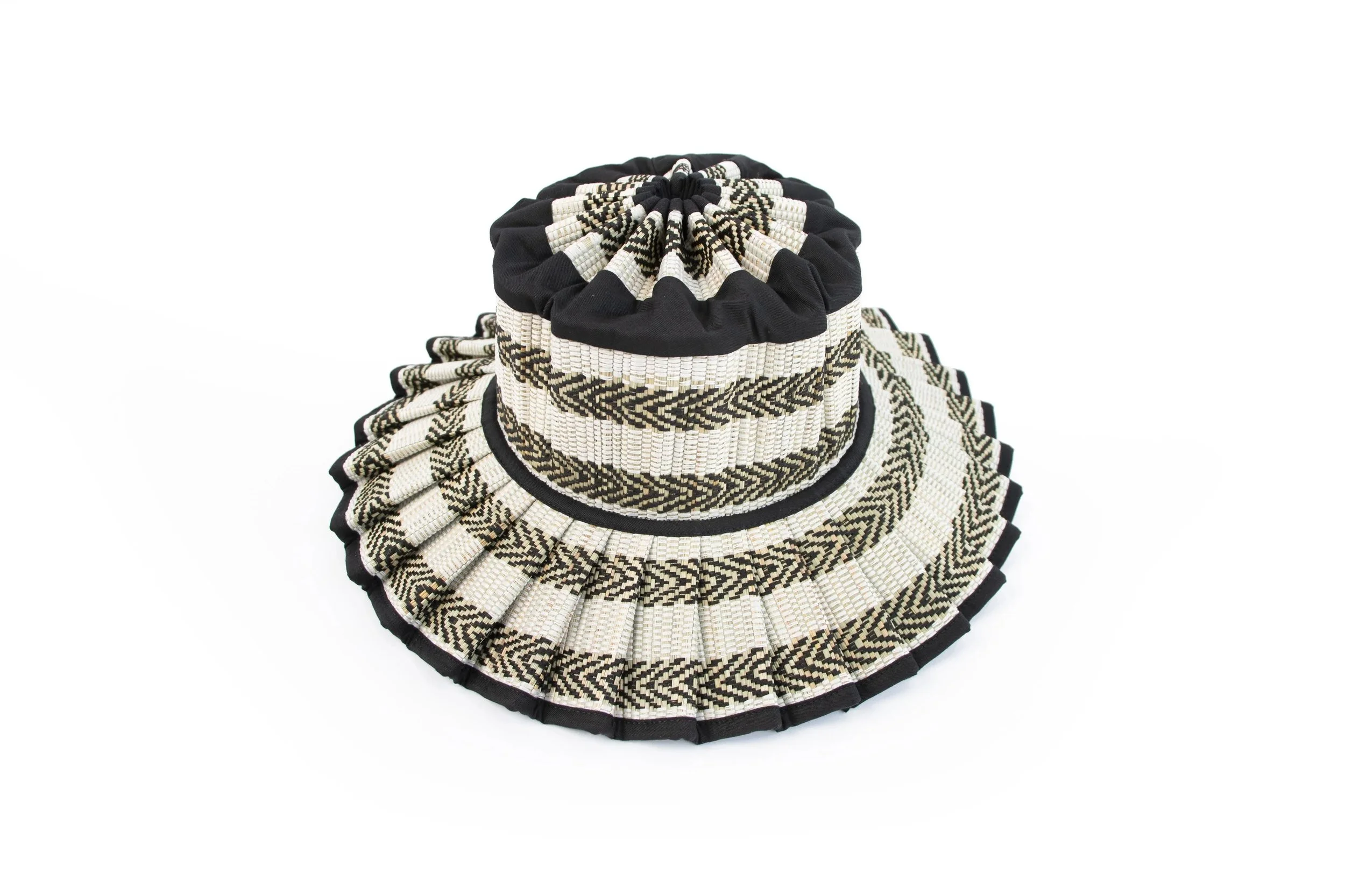 Kaimu Island Capri Hat – handwoven collapsible midi-brim sun hat with bold black-and-white diagonal stripes, available at Goosebump Hong Kong.