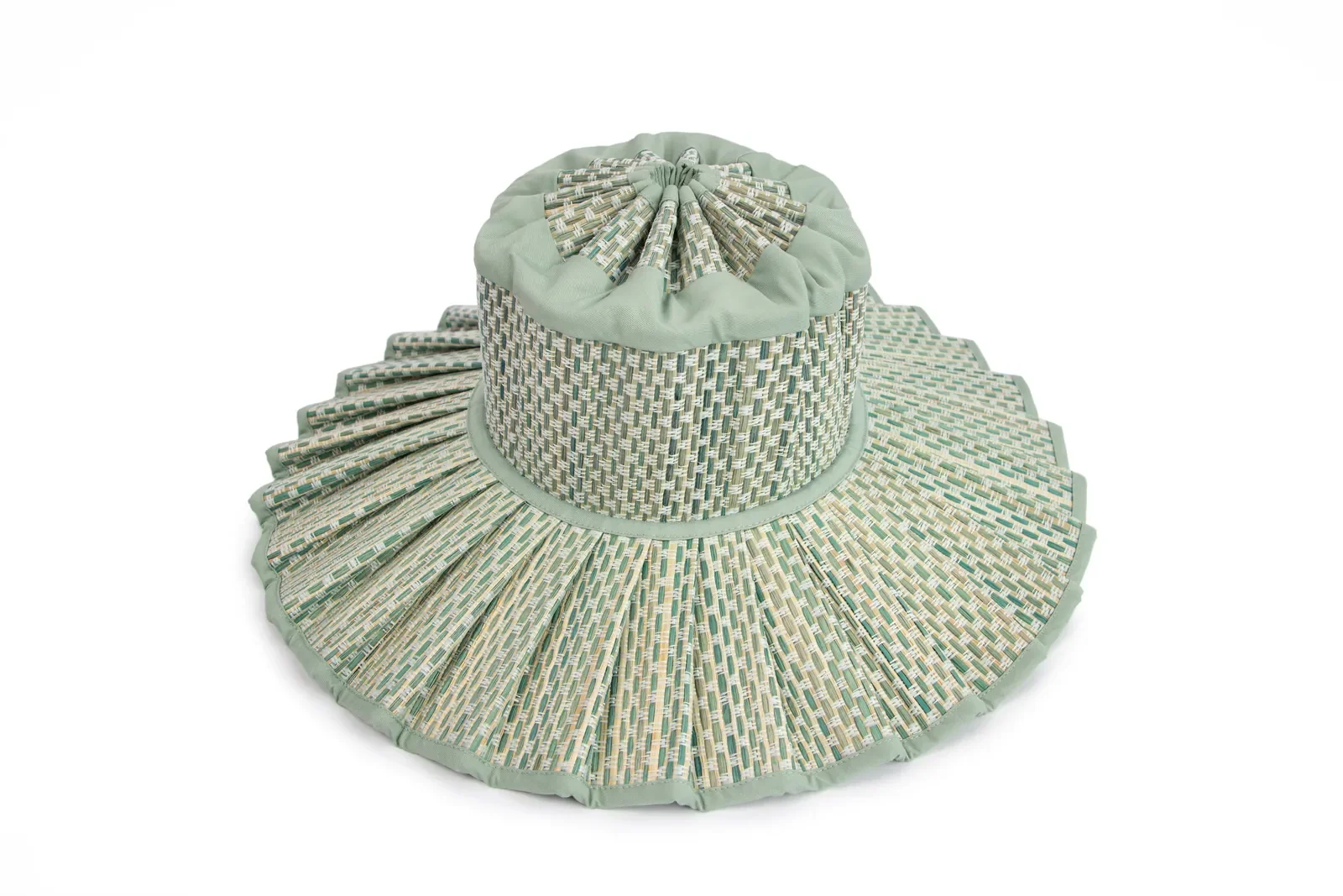 Angled front view of the Lorna Murray Fiji Capri Hat highlighting its pleated woven brim and handcrafted construction.