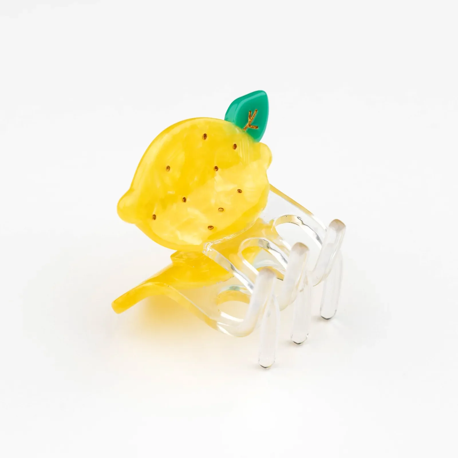 Discover Coucou Suzette Mini Lemon Hair Claw, a cheerful French fruit-inspired hair accessory in glossy cellulose acetate. A sweet little gift, curated by Goosebump in Hong Kong.