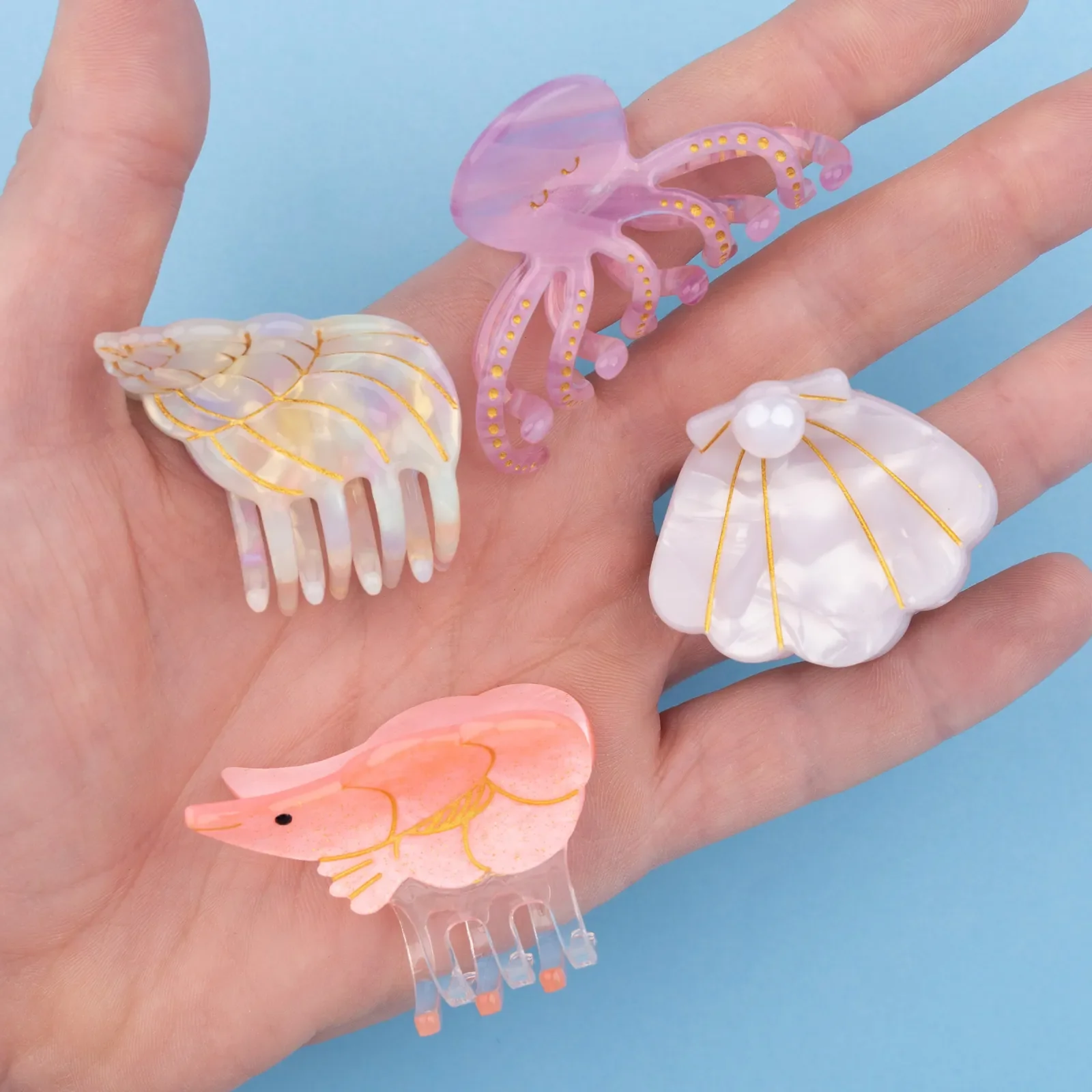 Coucou Suzette Mini Shrimp Hair Claw in glossy cellulose acetate, a quirky sea-inspired French hair accessory curated by Goosebump.